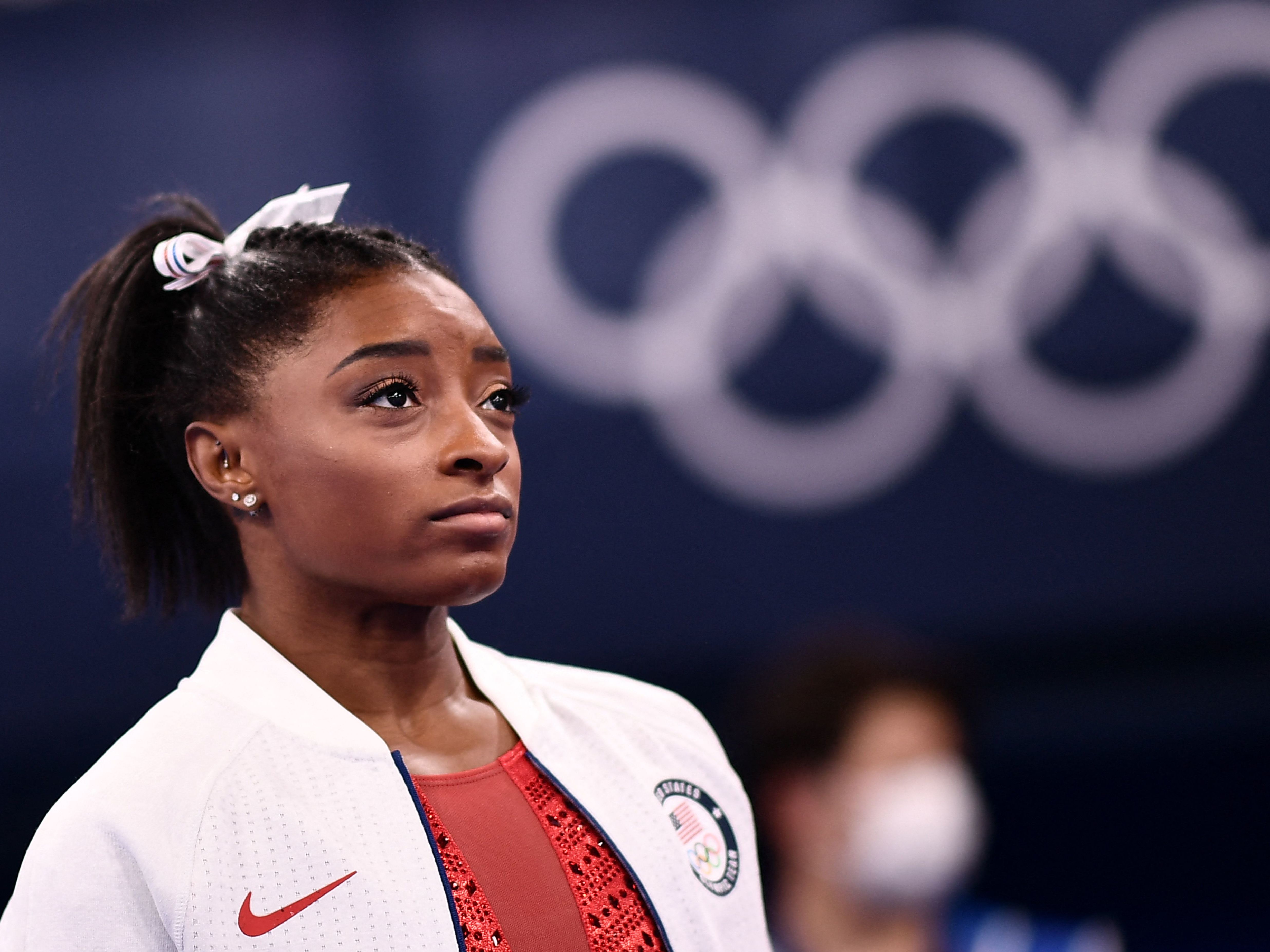 U.S. gymnast Simone Biles watches the artistic gymnastics women's team final during the Tokyo Olympics at the Ariake Gymnastics Centre on Sunday. (AFP via Getty Images)