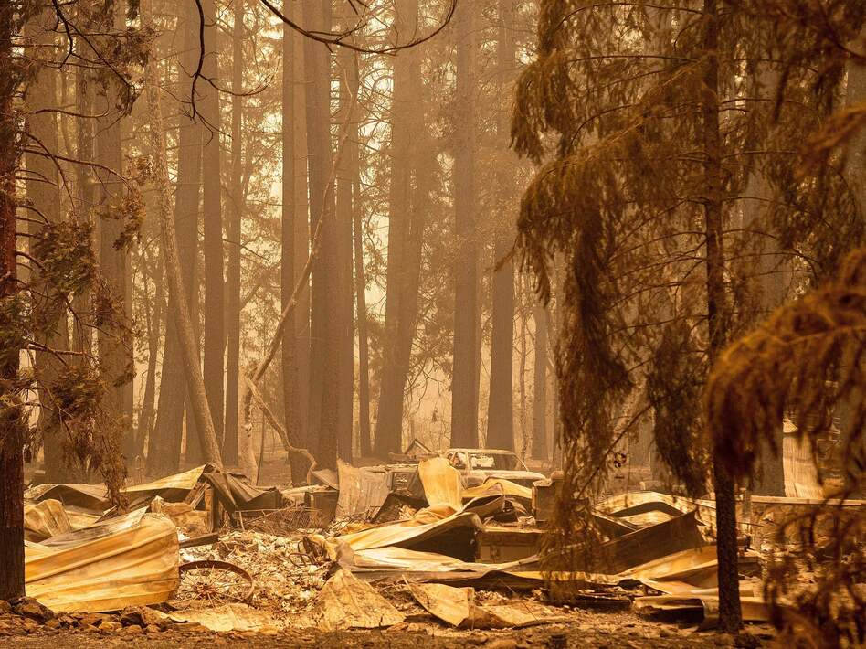 The remains of a burned home are seen in the Indian Falls neighborhood of unincorporated Plumas County, California on July 26, 2021. Extreme weather events have claimed hundreds of lives worldwide in recent weeks, and upcoming forecasts for wildfire and hurricane seasons are dire. (Josh Edelson/AFP via Getty Images)