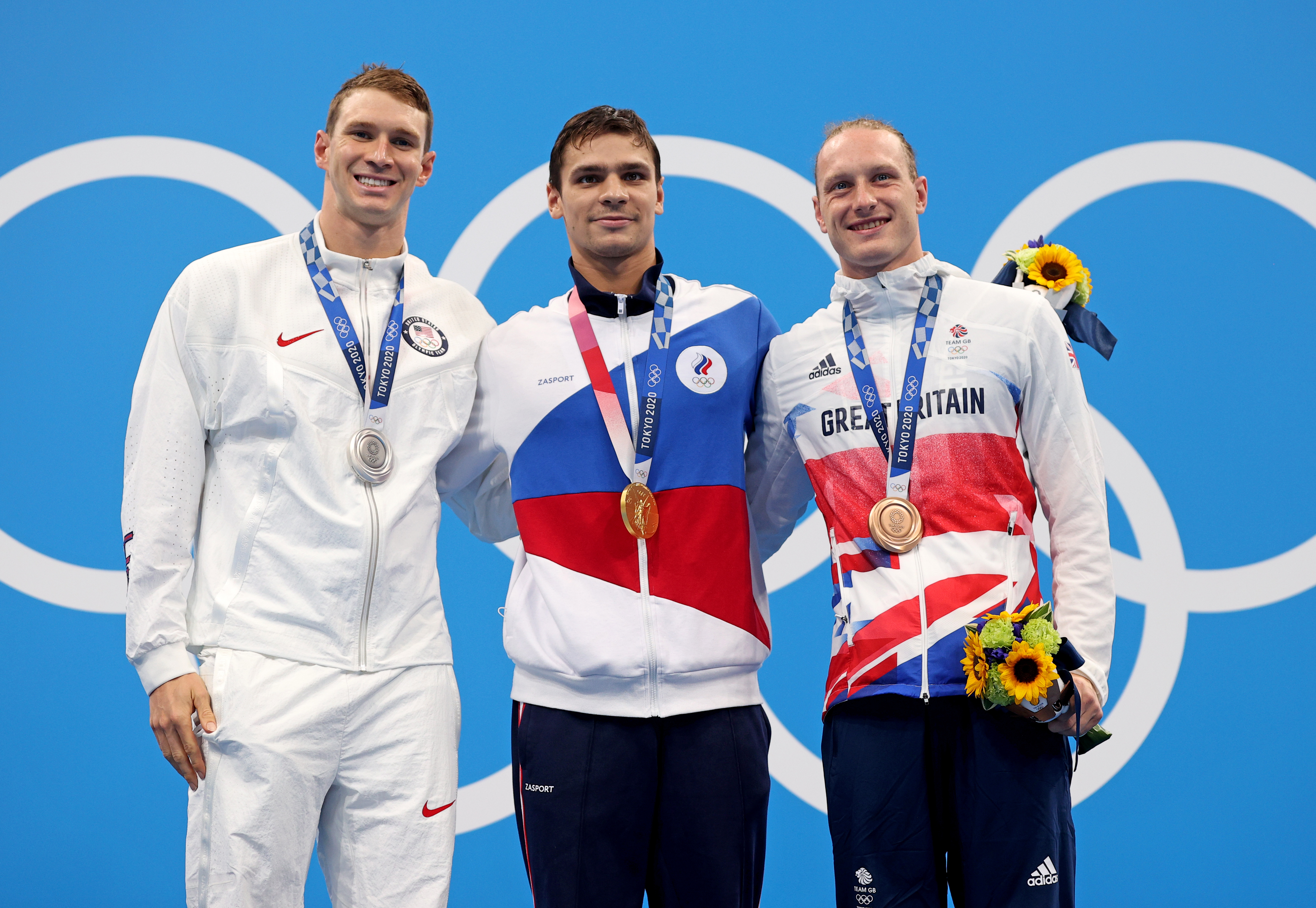 Silver medalist Ryan Murphy of Team USA (from left), gold medalist Evgeny Rylov of the Russian Olympic Committee and bronze medalist Luke Greenbank of Great Britain during Friday's medal ceremony for the men's 200-meter backstroke final at the Tokyo Games. (Getty Images)