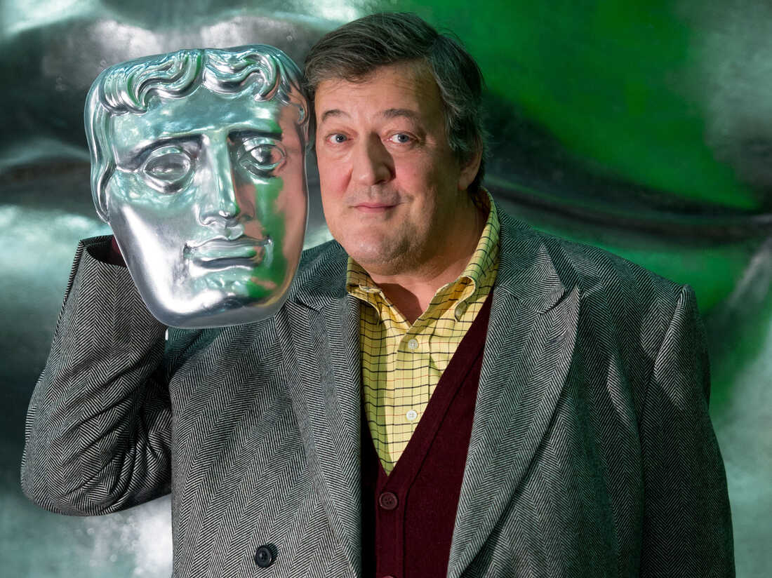 Stephen Fry poses on stage with a BAFTA mask ahead of the British Academy Film Awards at the Royal Opera House on Feb. 5, 2015, in London.