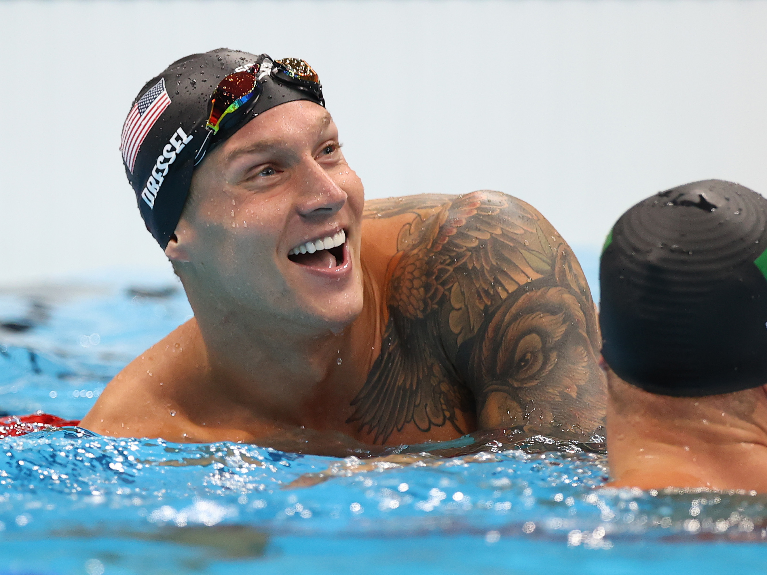 U.S. star Caeleb Dressel reacts after winning the gold medal and breaking the Olympic record in the men's 50 meter freestyle final at the Tokyo Olympics. (Getty Images)