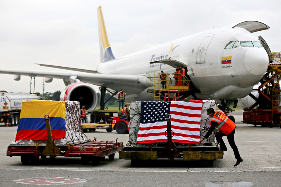 Containers of Moderna vaccines donated by the U.S. arrive last week in Bogotá, Colombia. (Leonardo Munoz/AFP via Getty Images)