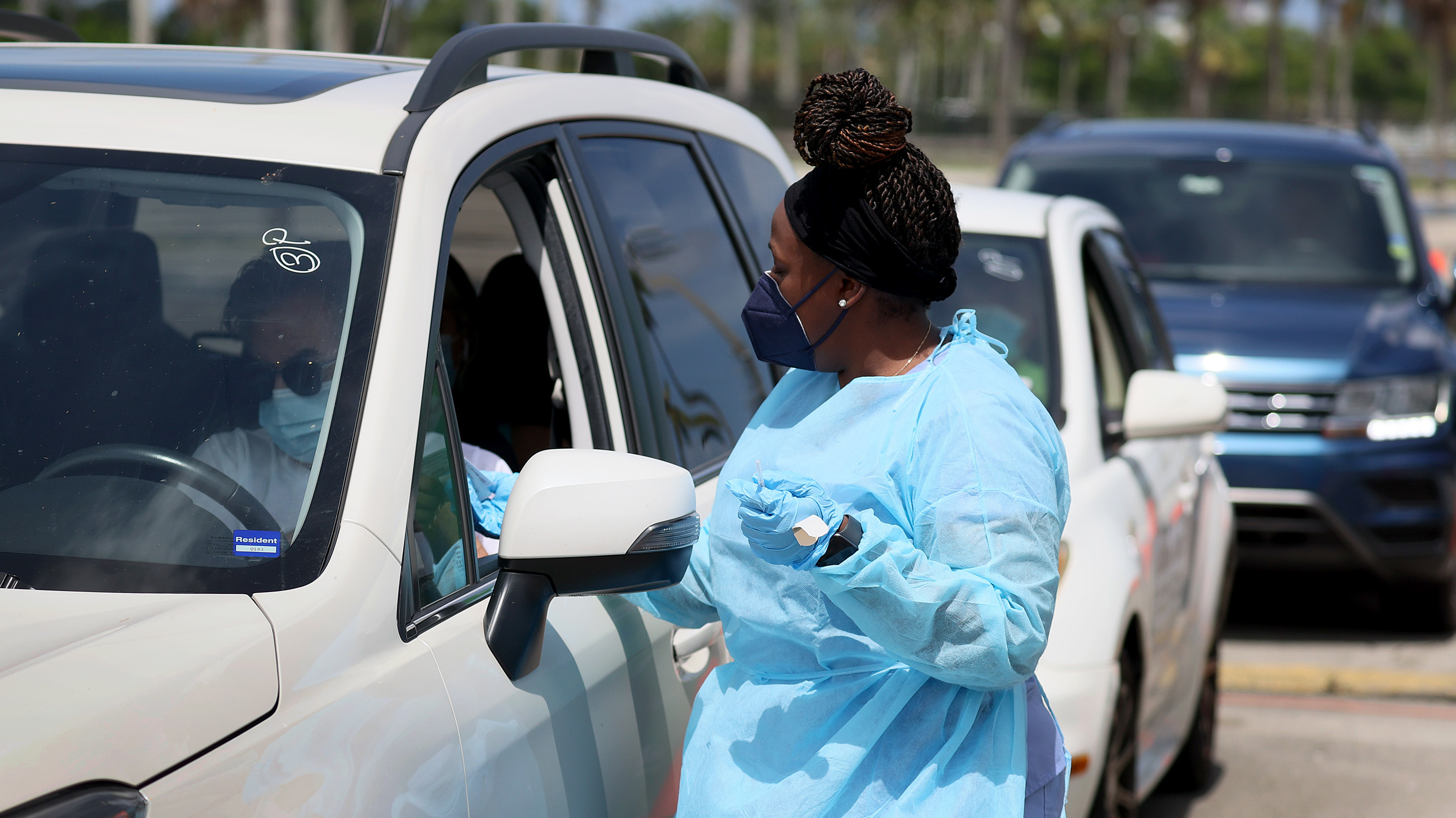 A health care worker at a drive-through site prepares to administer a COVID-19 vaccine on July 26 in Miami.
