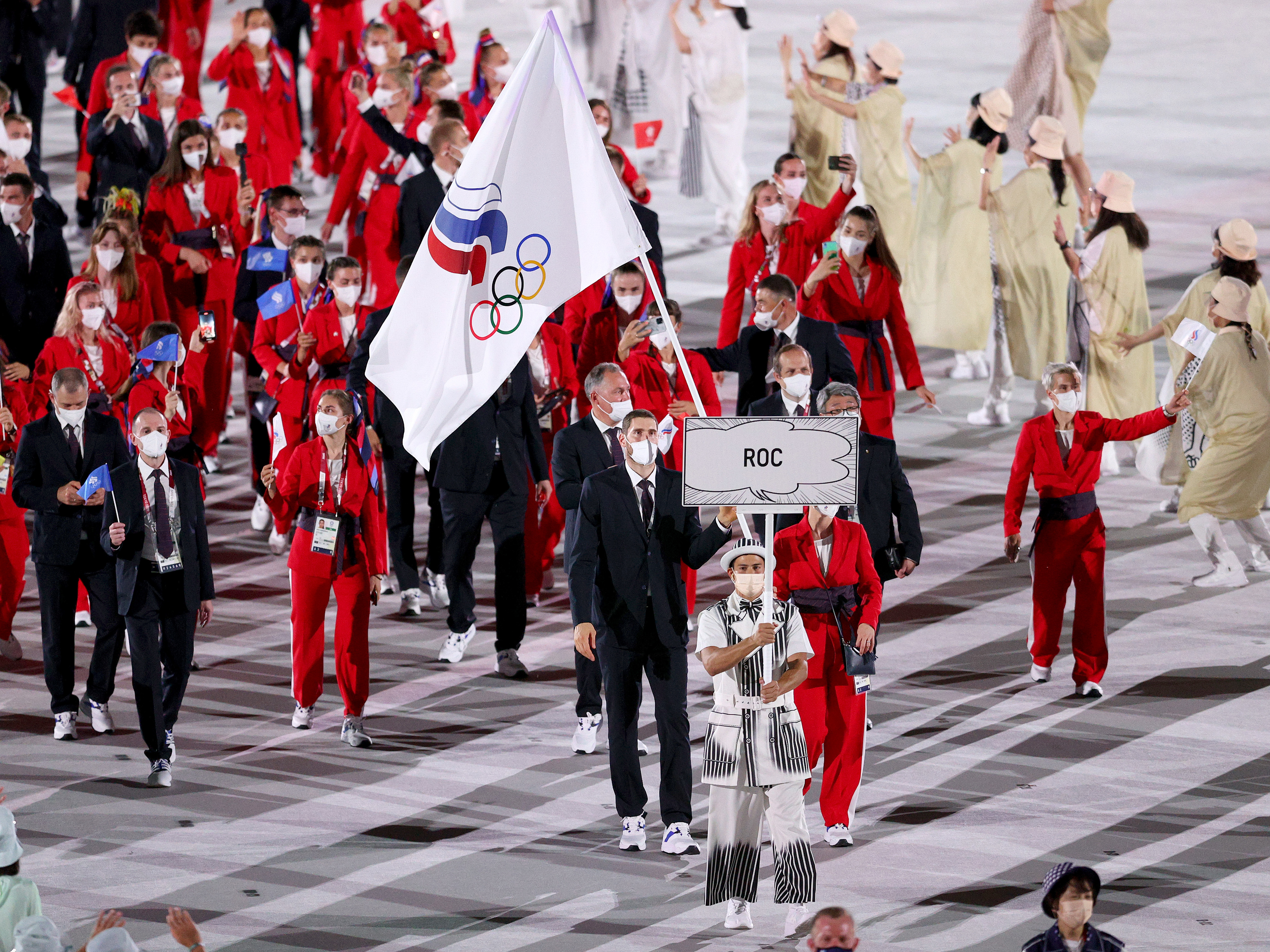 The team from the Russian Olympic Committee enters the Olympic Stadium during the opening ceremony of the Tokyo Olympics. They were prevented from flying the Russian flag because of ongoing doping penalties. (Getty Images)