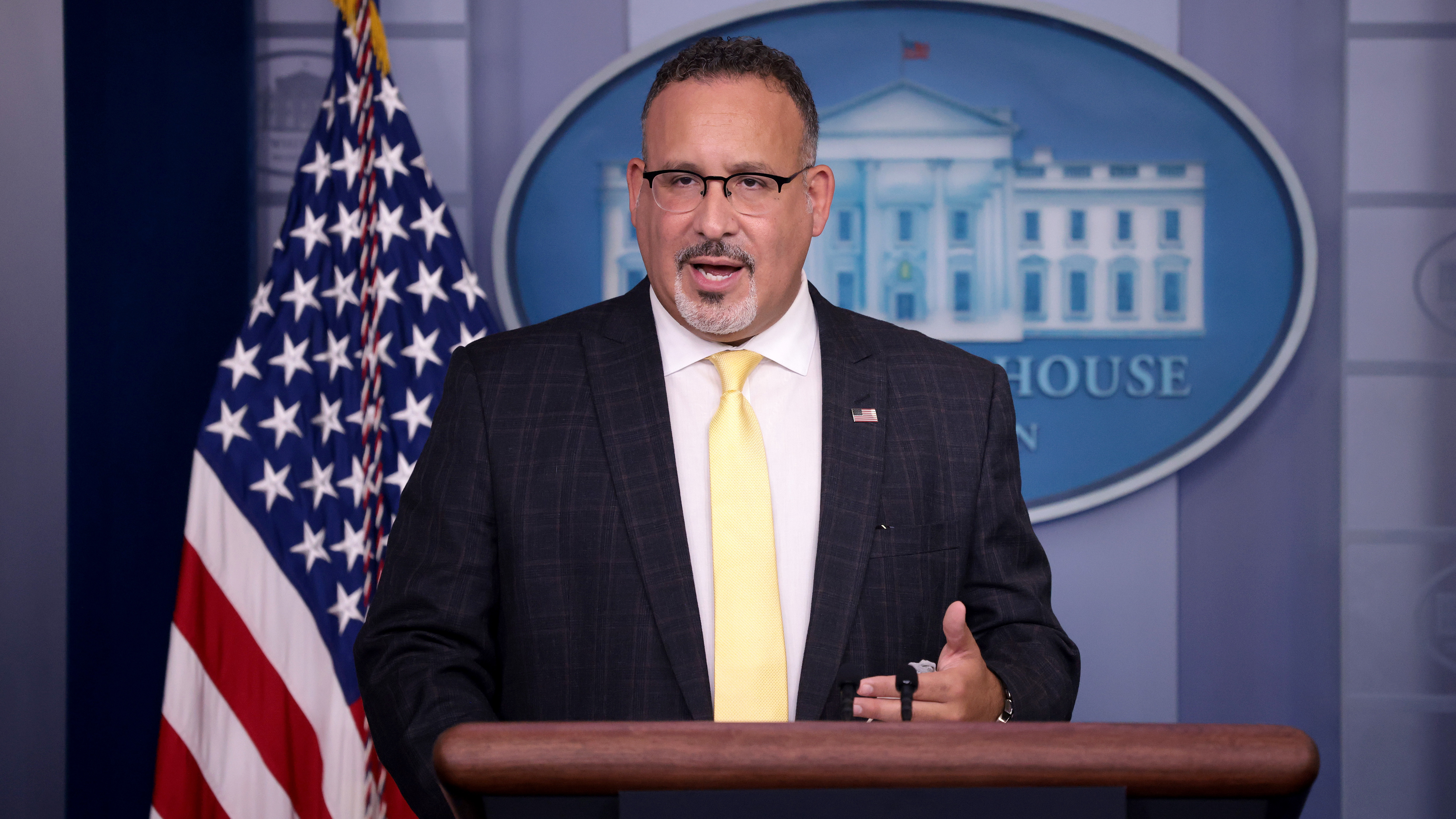 U.S. Education Secretary Miguel Cardona answers questions during a White House news briefing on Thursday. (Getty Images)