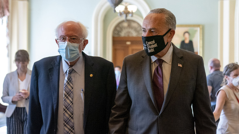 Senate Budget Committee Chair Bernie Sanders, I-Vt., and Senate Majority Leader Chuck Schumer of New York walk out of a budget resolution meeting at the Capitol on Aug. 9. (Andrew Harnik/AP)