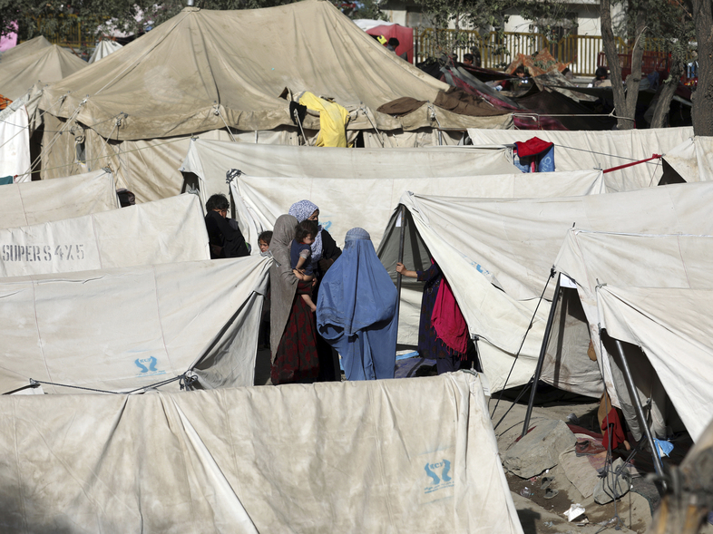 Internally displaced Afghans who have fled from northern provinces due to fighting between the Taliban and Afghan security personnel take refuge Friday in a park in Kabul. (Rahmat Gul/AP)
