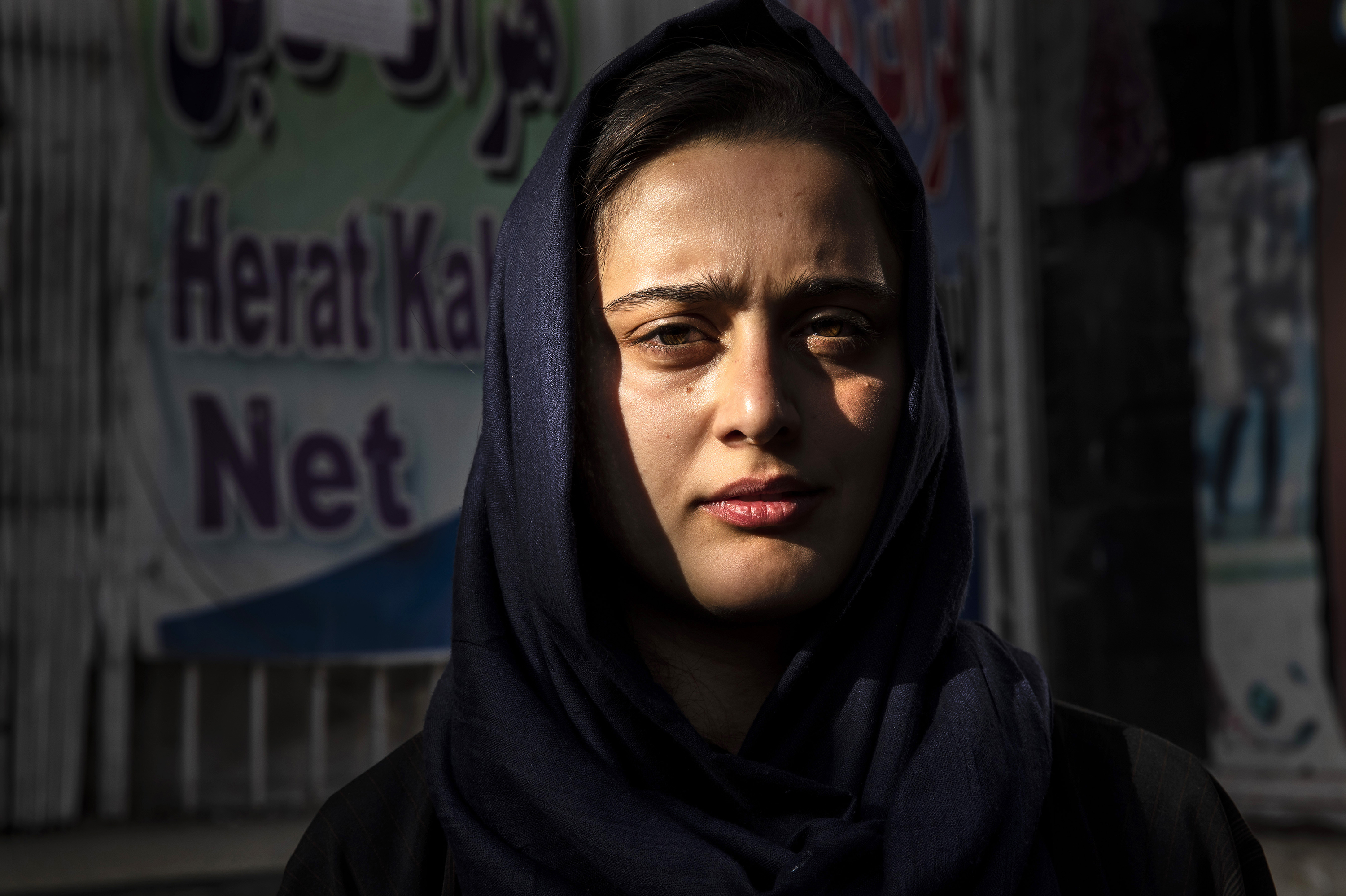 Dawlatt Naimati, 22, from Kunduz, stands outside an internet café where she is seeking help applying for a U.S. special immigrant visa on Aug. 8, in Kabul, Afghanistan. (Getty Images)