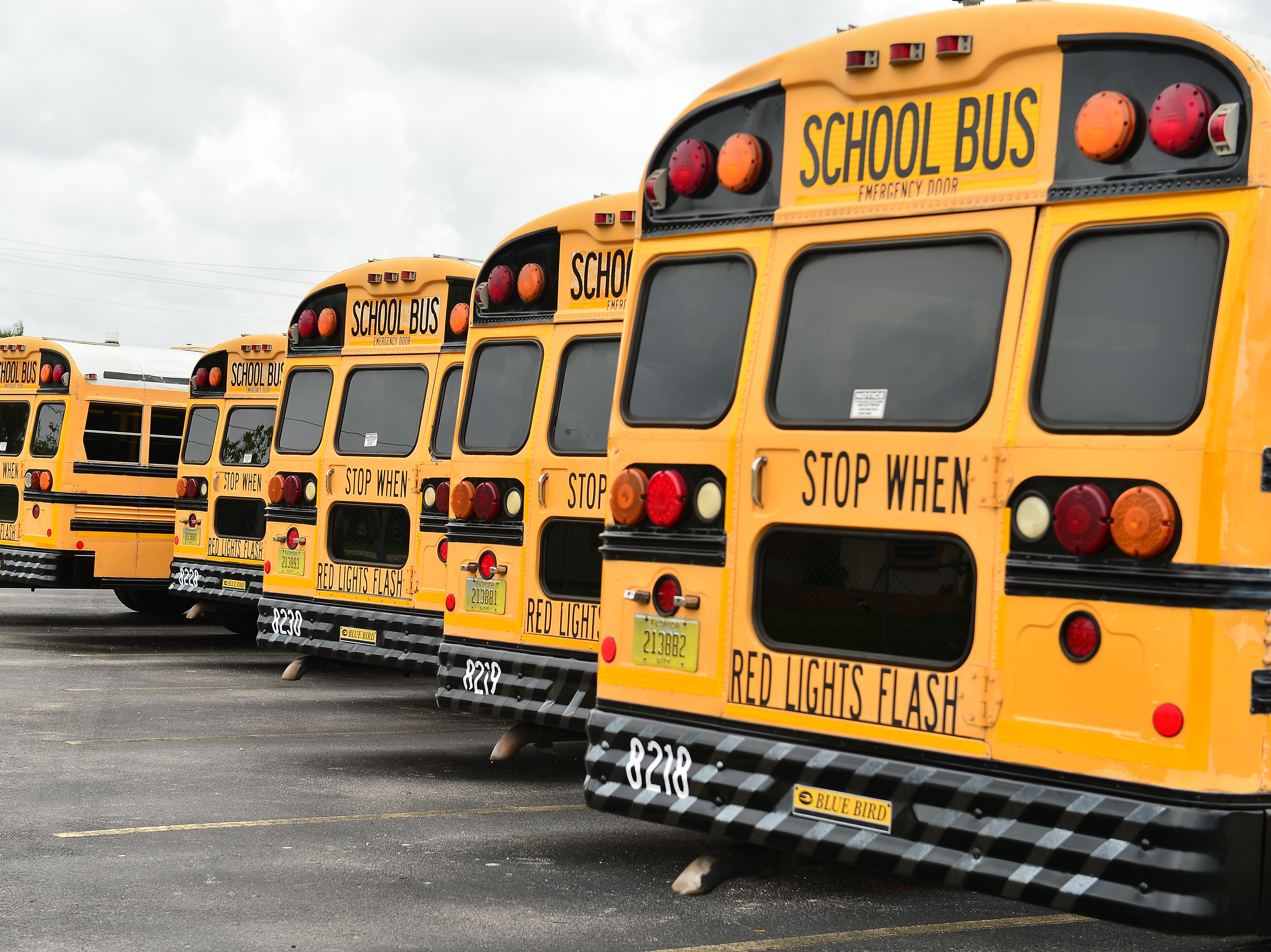 A fleet of Broward County School Buses are parked in a lot on July 21, 2020, in Pembroke Pines, Fla. Three county educators have died of complications from the coronavirus. (Getty Images)