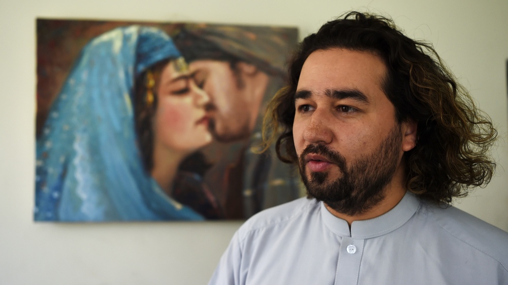 ArtLords co-creator Omaid Sharifi speaks during an interview at his studio in Kabul in August 2019. With the Taliban overrunning the capital on Sunday, he says his is unsure what the future holds for his art and his organization. (AFP via Getty Images)