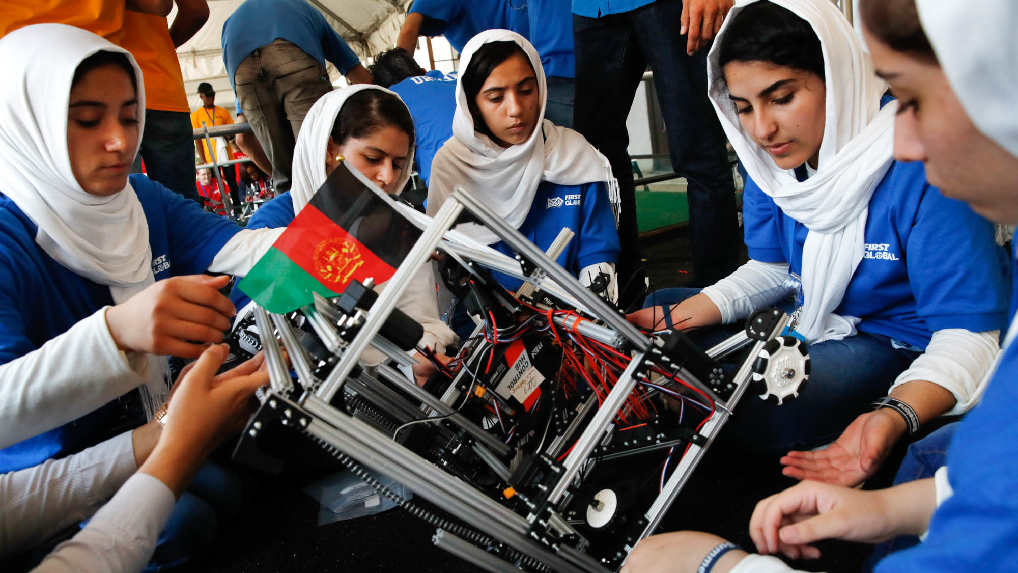 The Afghan Girls Robotics Team works on their robot at a 2017 competition in Washington. The girls, some of them now young women, face a precarious future with the Taliban back in control of the country.