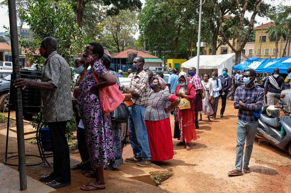 People line up last week to receive COVID-19 vaccines in Kampala, Uganda, after weeks of no supply. In Uganda, only 2.2% of the population had received one dose of a vaccine as of Aug. 15. (Hajarah Nalwadda/Xinhua News Agency via Getty Images)