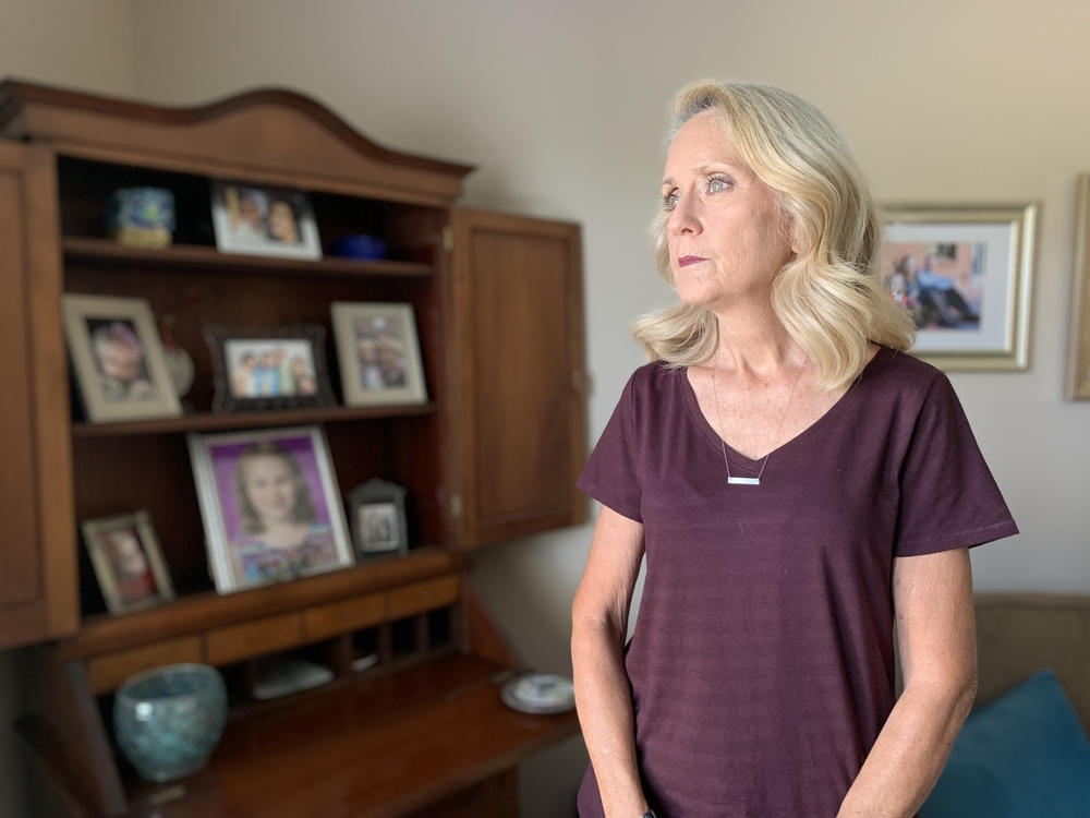 Elaine Murphy's home in New Albany, Ind., is lined with family photos of her grandchildren. The president of the school board of the New Albany-Floyd County school district is a life-long educator. Schools were always her safe haven, but things are changing as school boards are tasked with making pandemic-related decisions. (WFYI)