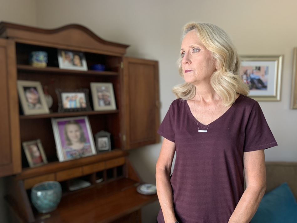 Elaine Murphy's home in New Albany, Ind., is lined with family photos of her grandchildren. The president of the school board of the New Albany-Floyd County school district is a life-long educator. Schools were always her safe haven, but things are changing as school boards are tasked with making pandemic-related decisions. (Farah Yousry/WFYI)