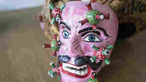 PHOTOS: Mexican Masks Portray COVID As A Tiger, A Devil, A Blue-Eyed Man