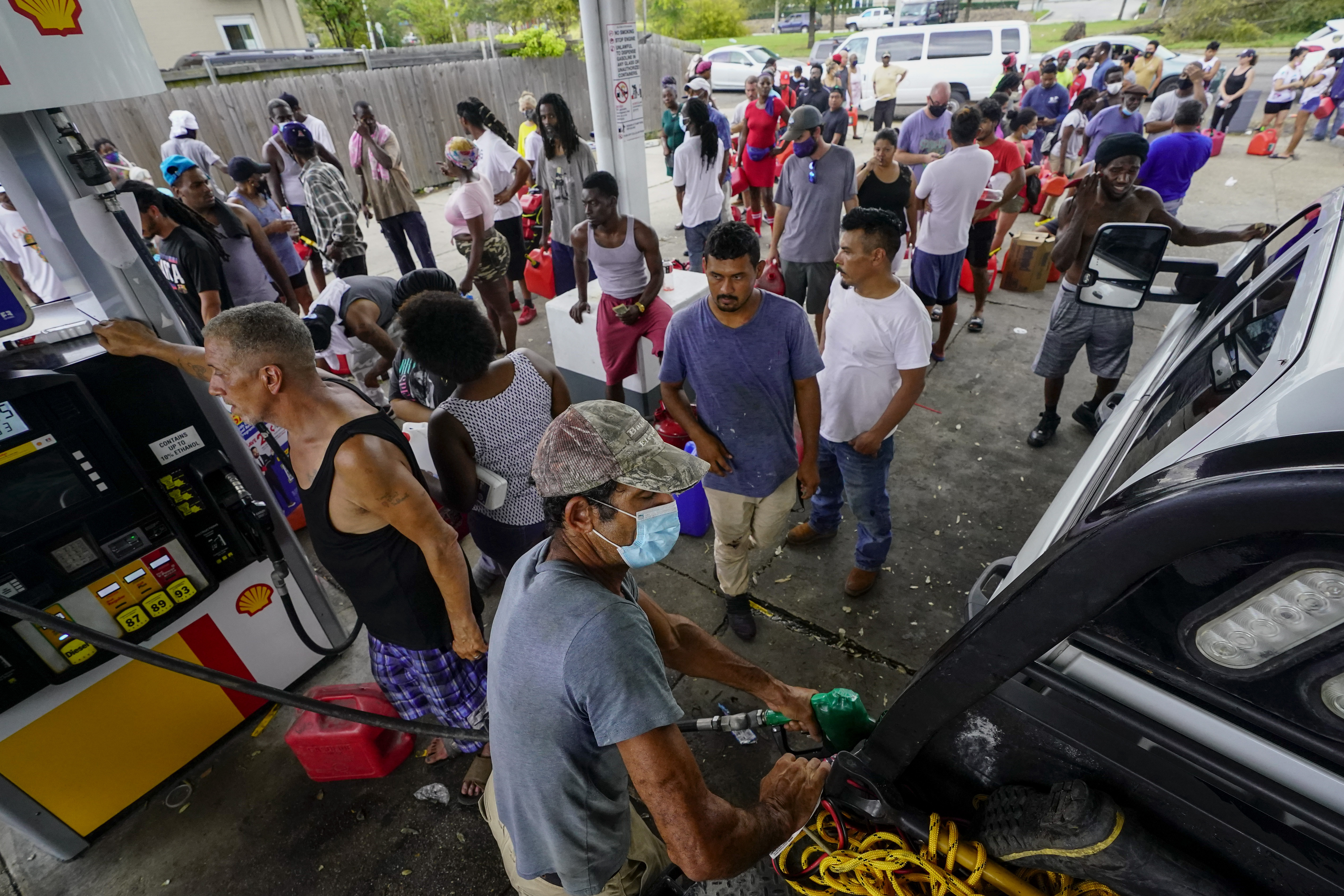Tues., Aug. 31: Ademir Sava fills his truck with gas after waiting in line for six hours in New Orleans.