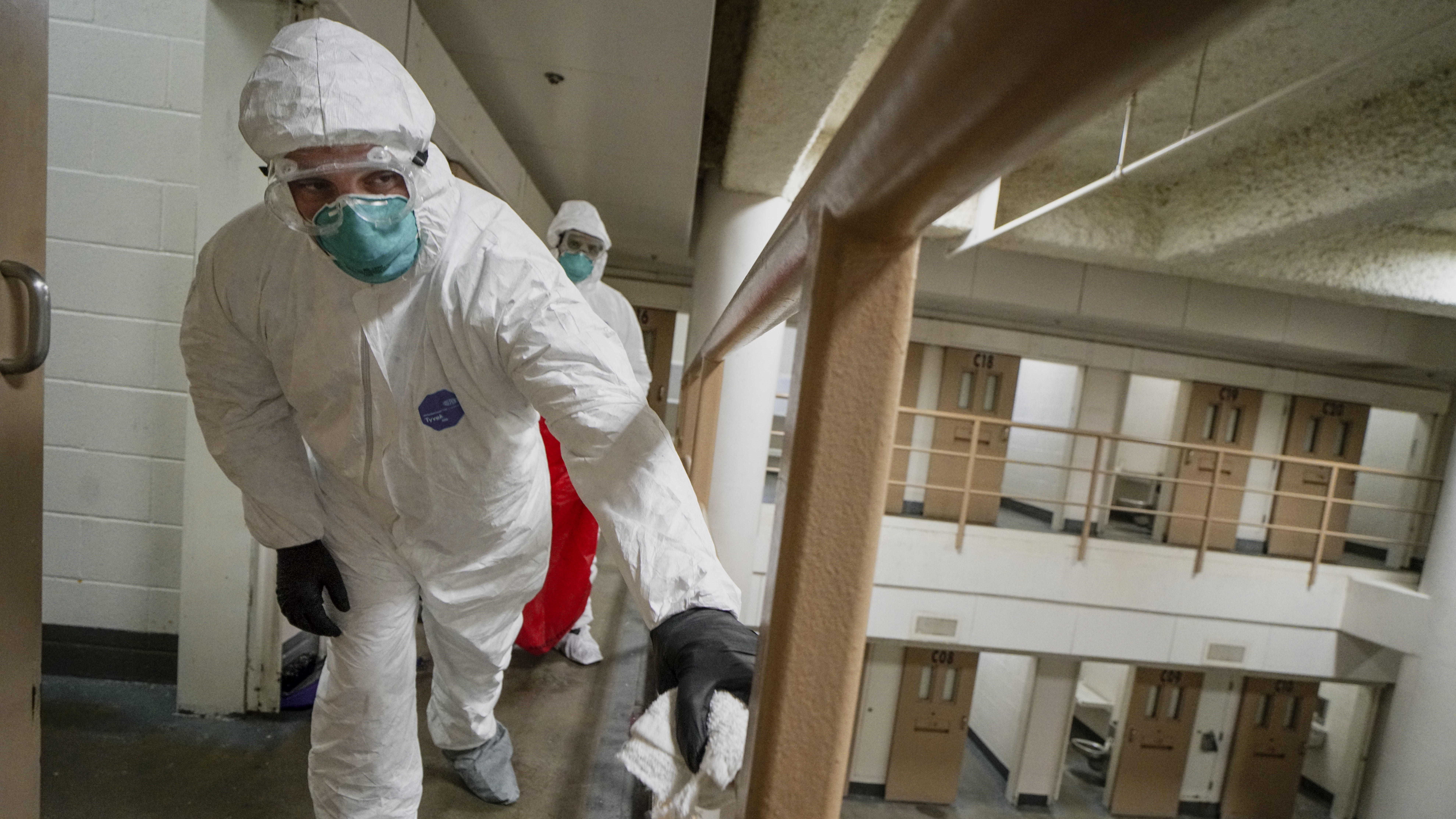 Inmates do a deep cleaning in a cell pod to prevent the spread of COVID-19 at the San Diego County Jail on April 24, 2020. A new study says crowded jails may have contributed to millions of COVID-19 cases across the U.S.