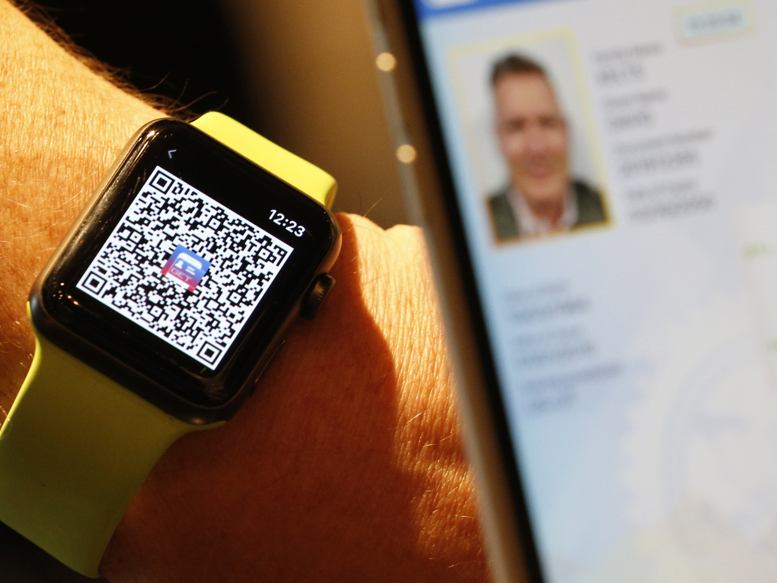 A person scans a QR Code on an Apple Watch to send a digital driver's license temporarily to another mobile phone last month in Salt Lake City. Utah is among eight states that eventually will let users add a license or state ID to Apple Wallet. (Getty Images)