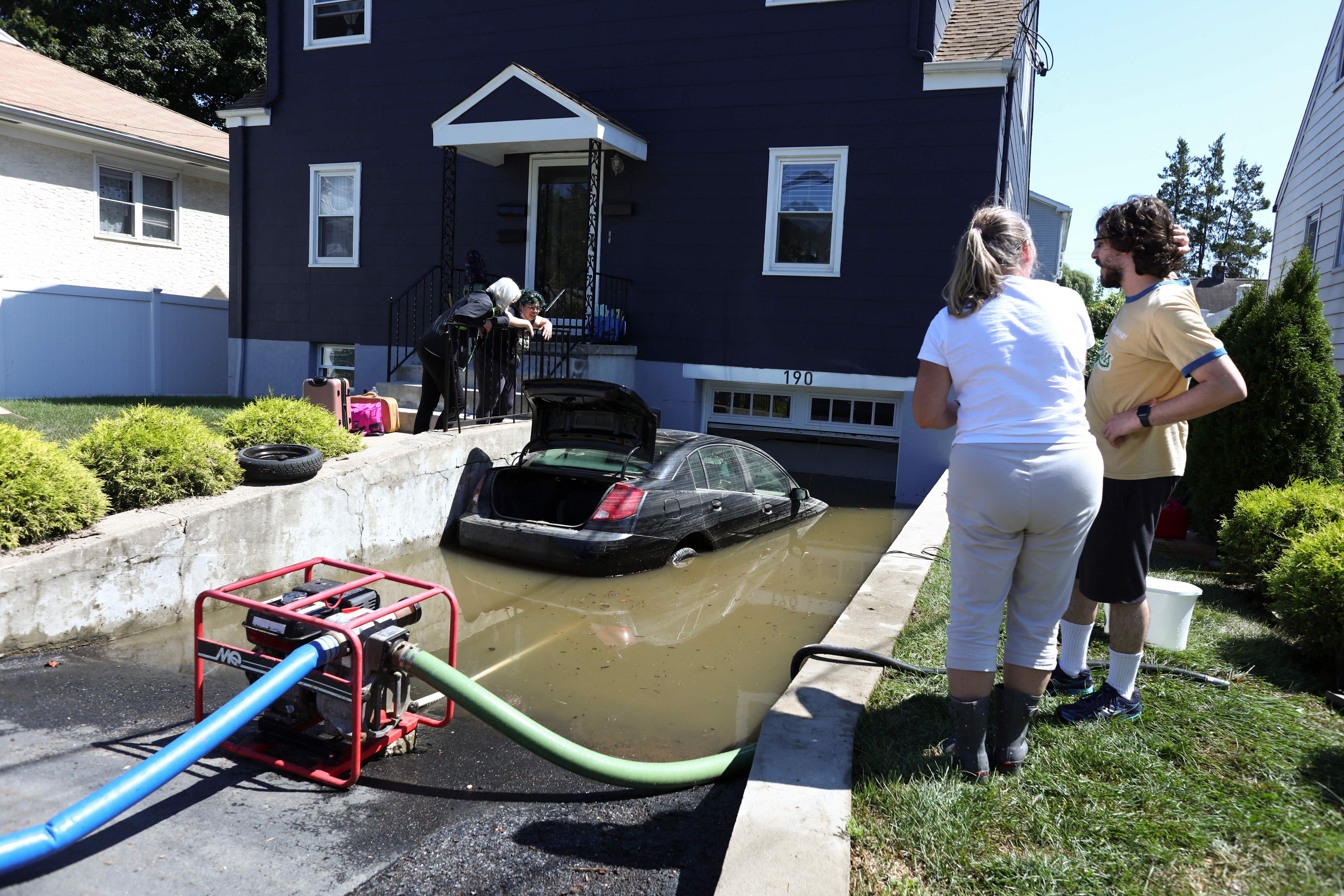 Thursday., Sept. 2: A car sits in a flooded driveway of a house in Mamaroneck, N.Y., after a night of heavy wind and rain from the remnants of Hurricane Ida.