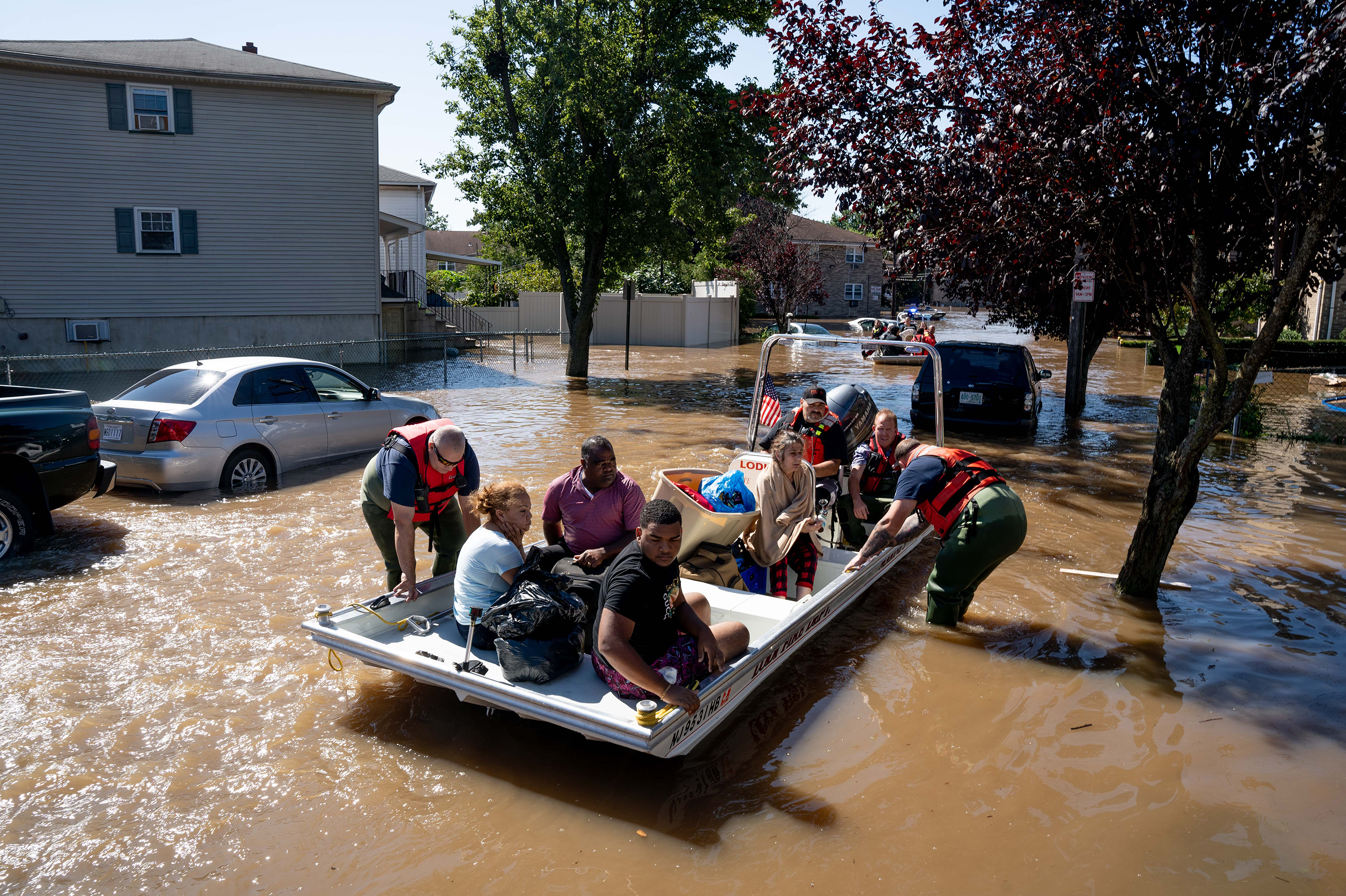 Members of the fire department in Lodi, N.J., perform water rescues Thursday on residents trapped after torrential rains from the remnants of Hurricane Ida. (NurPhoto/Reuters)