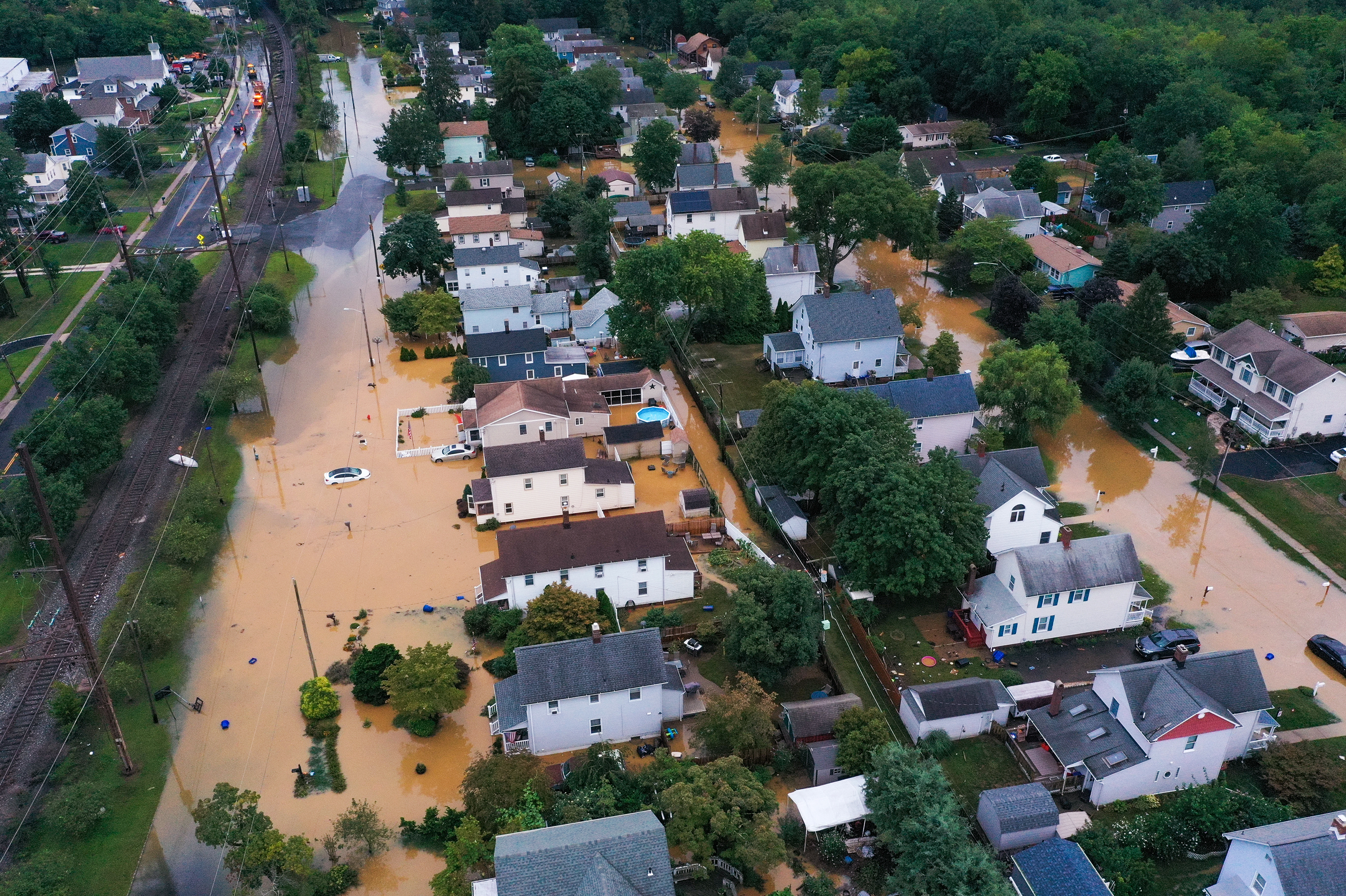 Homes that were sold by the Department of Housing and Urban Development between January 2017 and August 2020 are in federally designated flood zones at almost 75 times the rate of all homes sold nationwide in that period. New Jersey is one hot spot. Here, flooding from Tropical Storm Henri in Helmetta, N.J., this August. (Anadolu Agency via Getty Images)