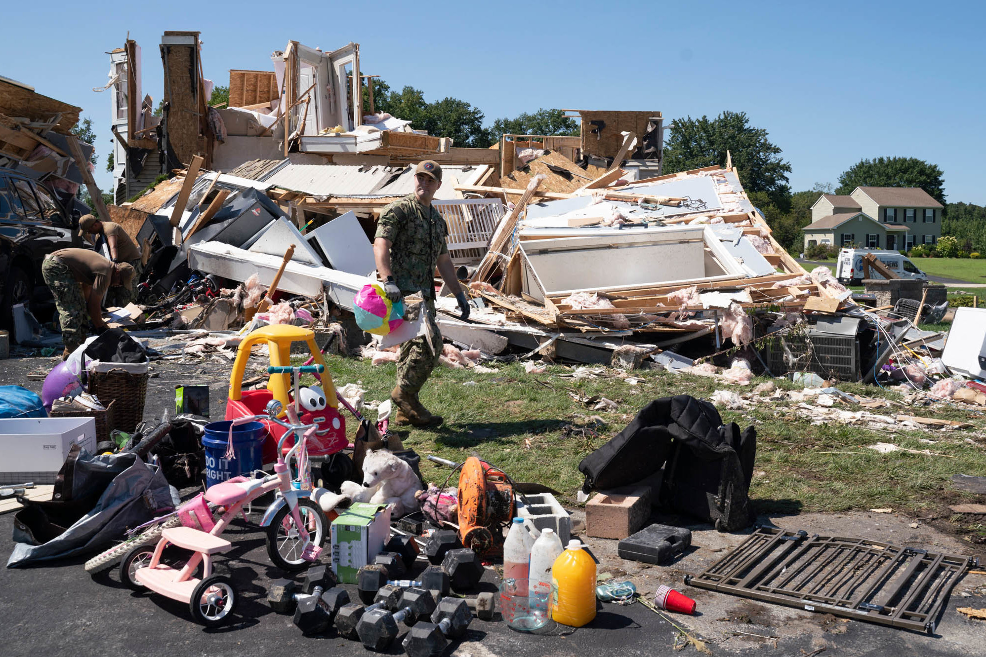 <strong>Thursday., Sept. 2: </strong>A group of Navy recruiters in Philadelphia help clear debris from the house of Ashley Thomas which was destroyed by a tornado in Mullica Hill, New Jersey. (AFP via Getty Images)