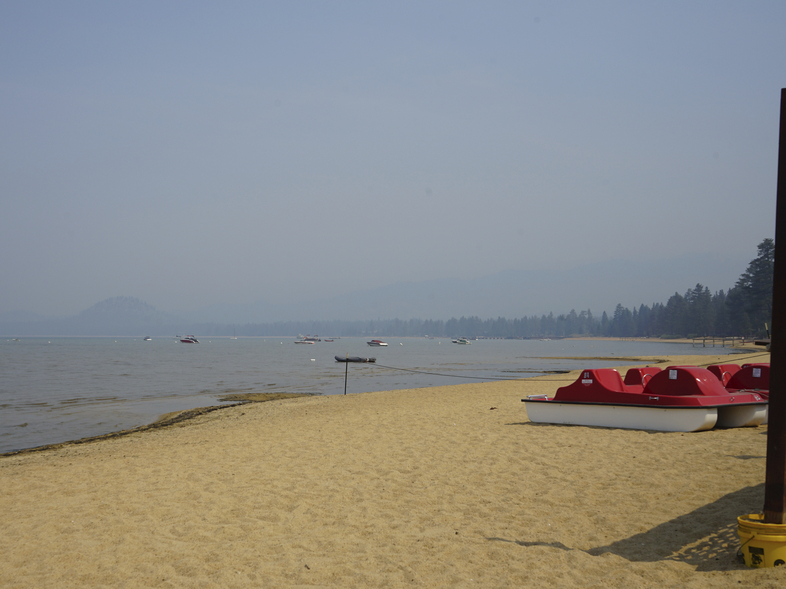 Smoke shrouds parts of Lake Tahoe visible from the Ski Run Marina in downtown South Lake Tahoe on Monday. (Samuel Metz/AP)
