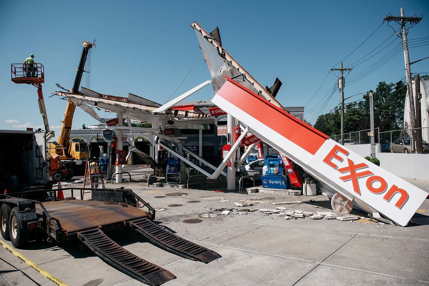 Workers clean a gas station damaged by the remnants of Hurricane Ida in New York City. Scientists warn that 60% of world oil reserves need to stay underground to avoid the worst impacts of climate change. (Getty Images)