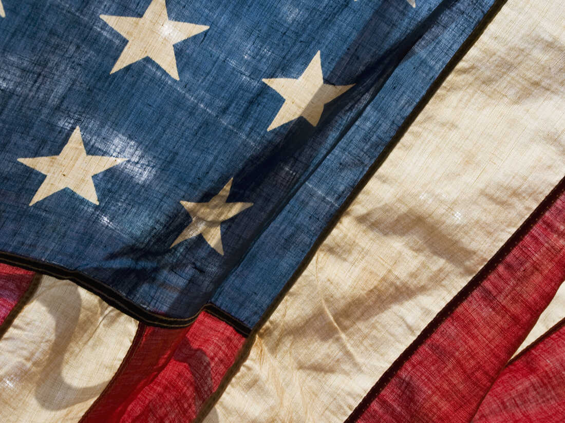 Close-up photo of old American flag.