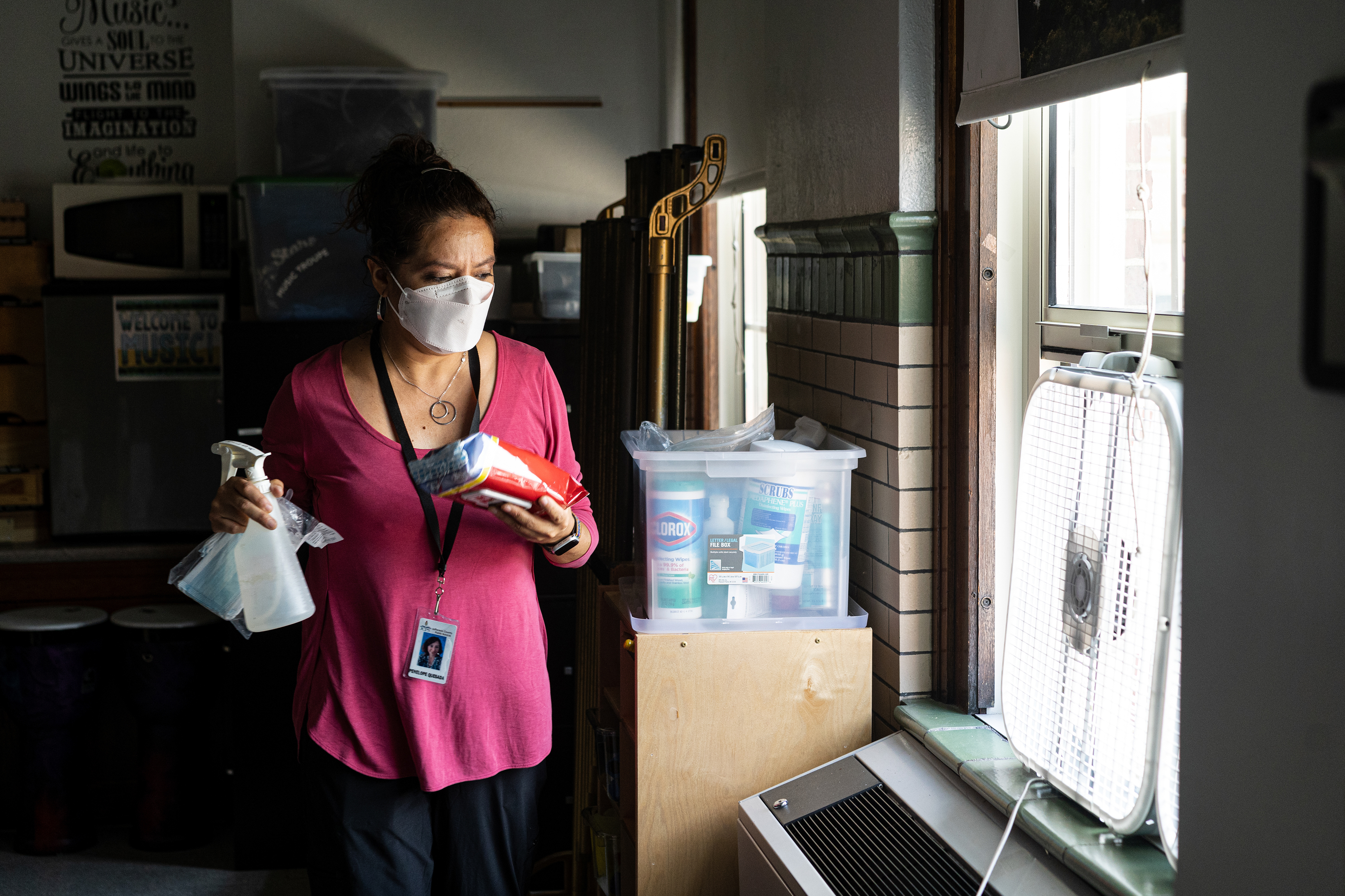 Before classes begin for the day, elementary music teacher Penelope Quesada gathers her most commonly used cleaning supplies and places them around the classroom in places of convenience. (Natosha Via for NPR)