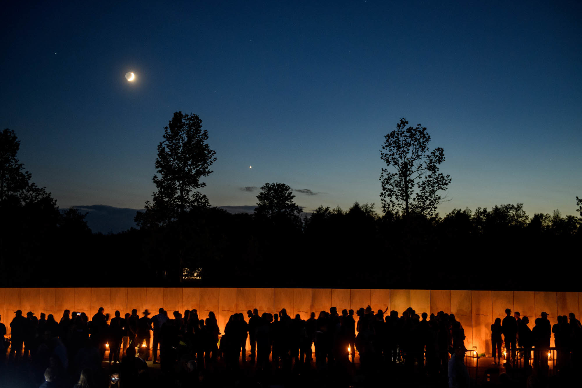 Photos: Scenes From 9/11 National Memorials 14 Visitors line the Wall of Names at the Flight 93 National Monument during the Luminaria Ceremony on Friday in Shanksville. The ceremony honors the 40 victims of Flight 93.