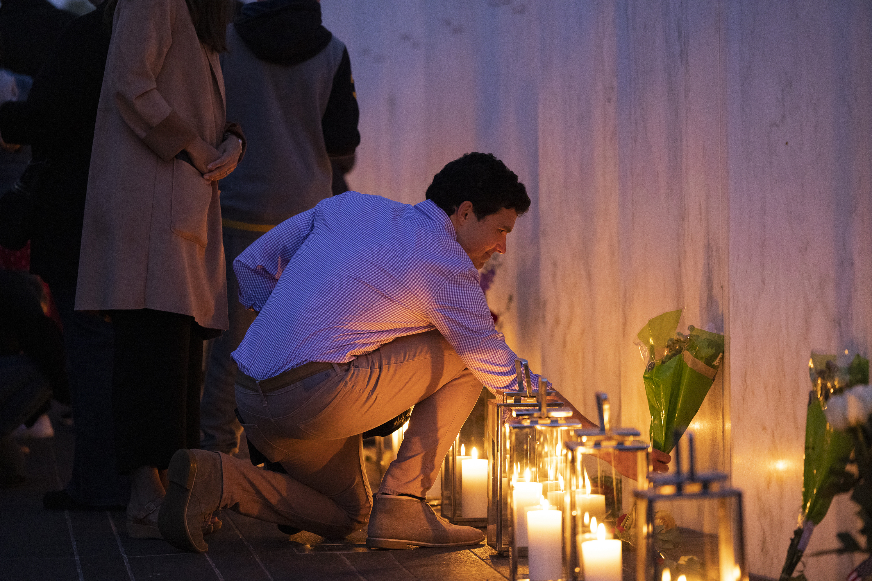 Photos: Scenes From 9/11 National Memorials 10 Charlie Greene places flowers for his father Donald Greene, who perished on Flight 93, during a ceremony Friday at Flight 93's Memorial Plaza in Shanksville, Pa.