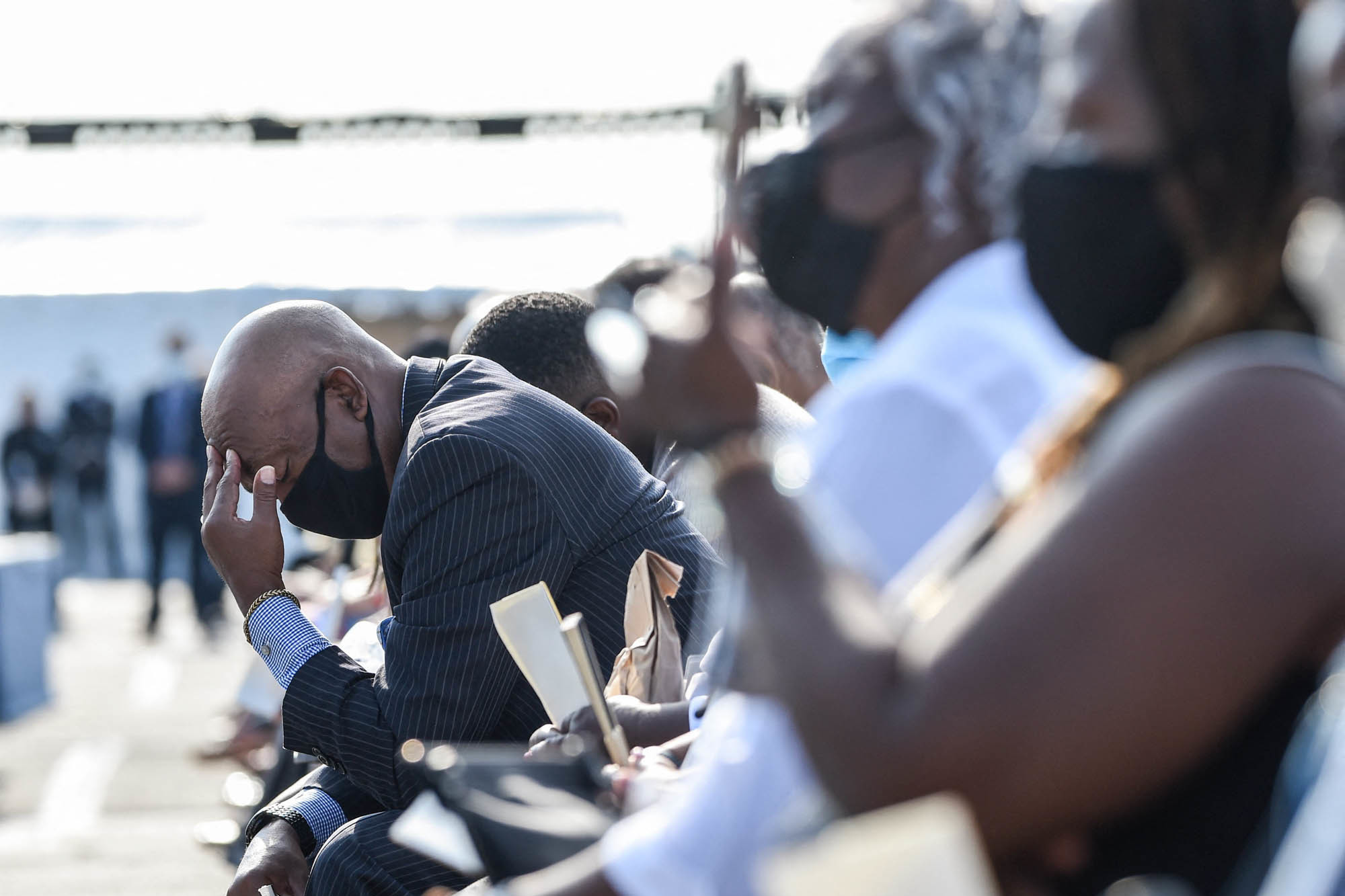 Photos: Scenes From 9/11 National Memorials 6 An attendee reacts during a 9/11 remembrance ceremony at the Pentagon in Arlington, Va., on Saturday.