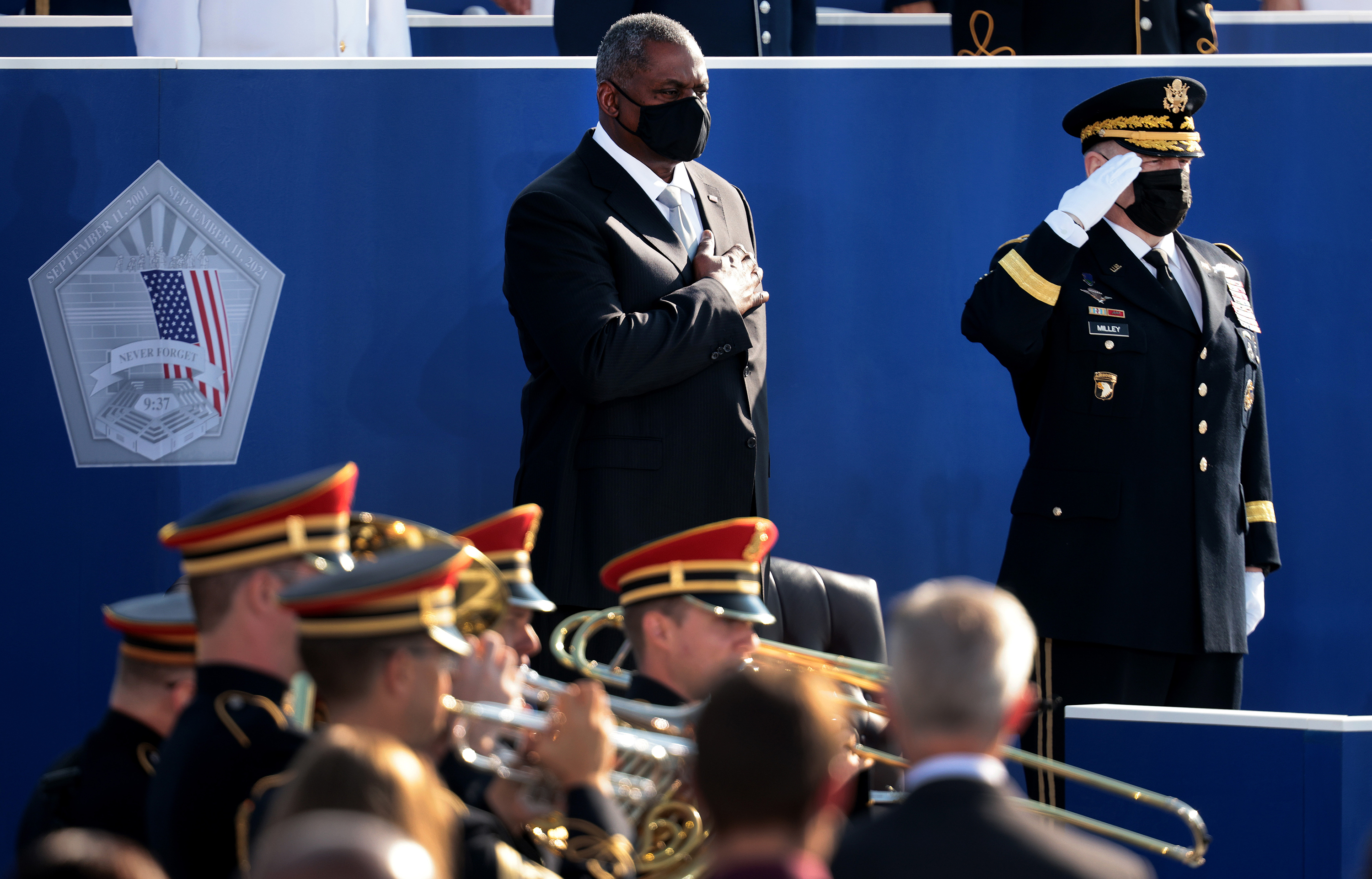 Photos: Scenes From 9/11 National Memorials 8 Defense Secretary Lloyd Austin (left) and Chairman of the Joint Chiefs of Staff Gen. Mark Milley stand for the national anthem during the Pentagon 9/11 observance ceremony.