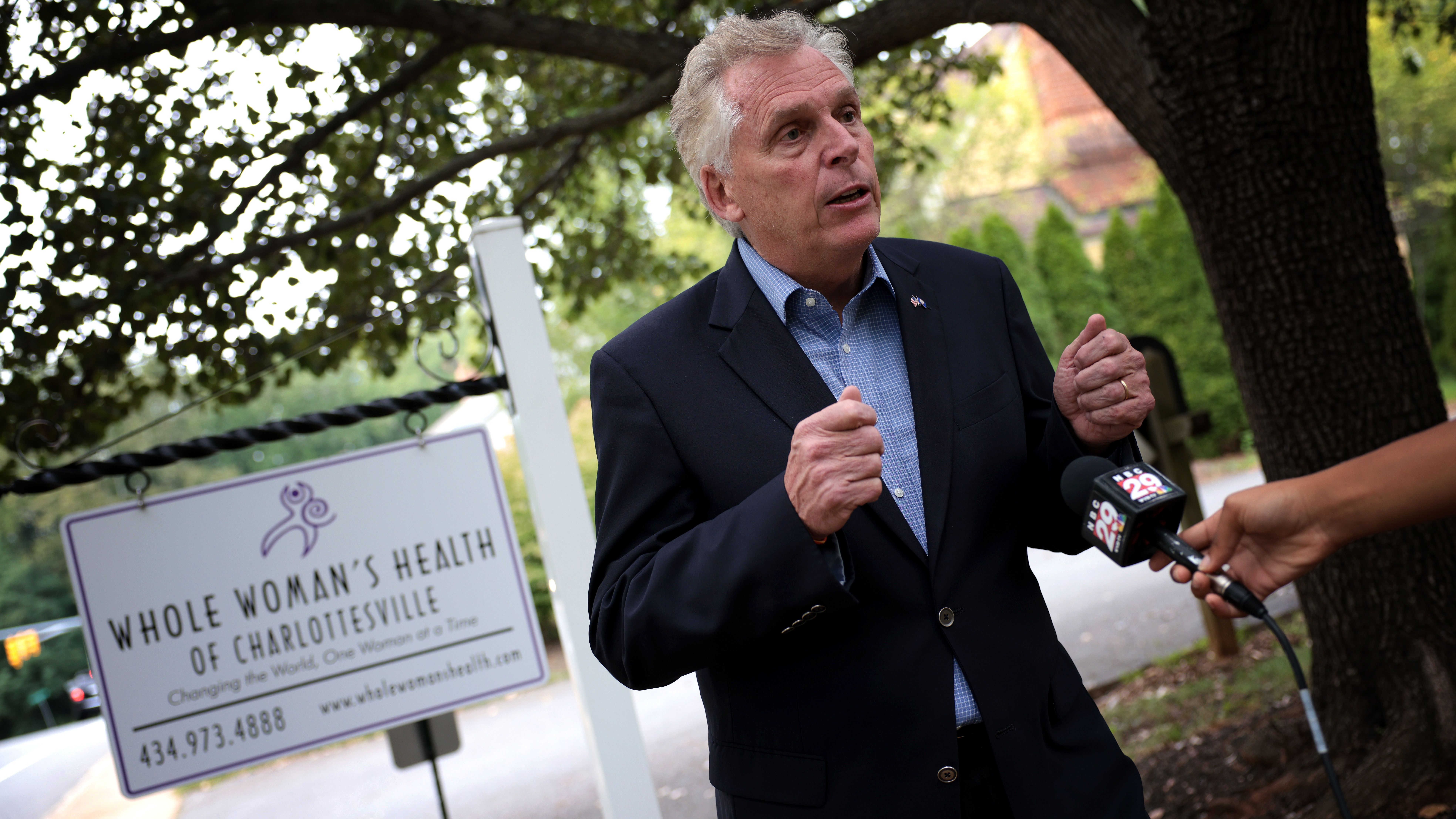 Former Virginia Gov. Terry McAuliffe, a Democrat running for a second term, answers questions from the media after touring Whole Woman's Health of Charlottesville on Sept. 9. He's working to rally voters in response to Texas' restrictive new abortion law. (Getty Images)