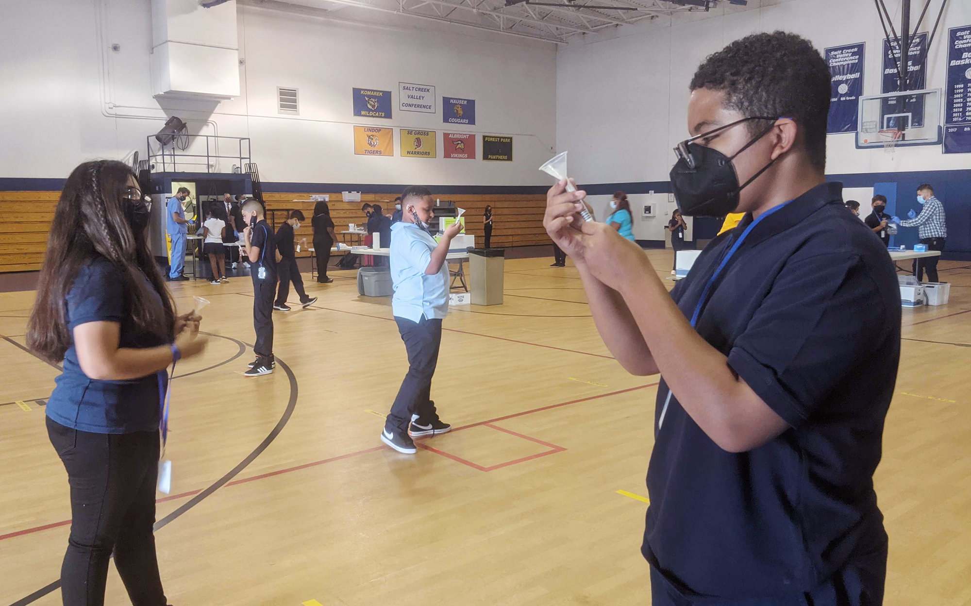 Julian Hernandez (right), 12, a seventh-grader at Hillside School in Illinois, says he feels much safer being back in school knowing that a weekly testing program is identifying those who are sick with COVID-19. (Christine Herman/WILL)