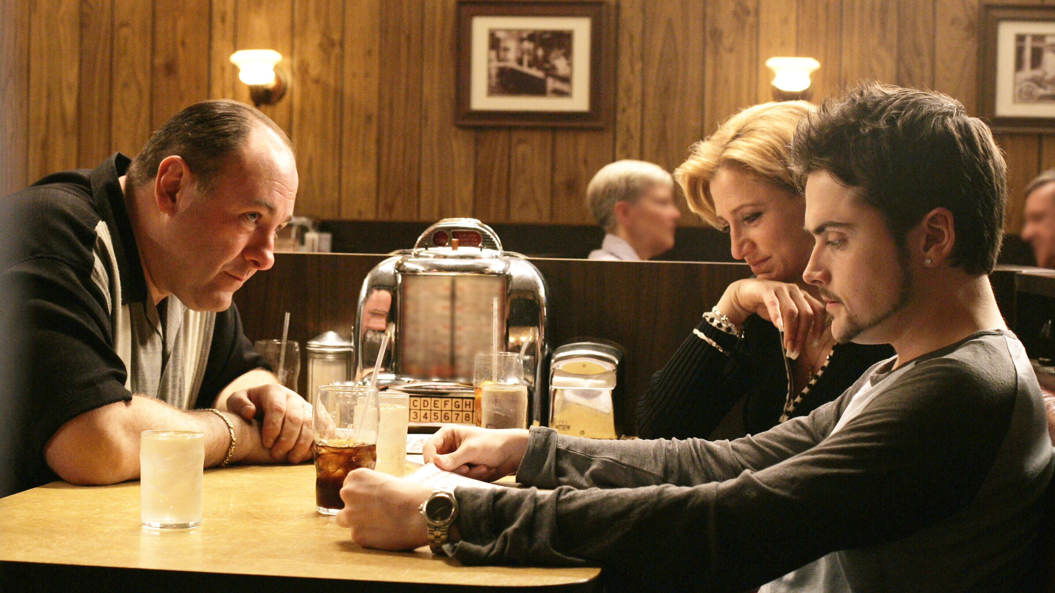 James Gandolfini, Edie Falco, Robert Iler listening to Journey in the series finale of <em>The Sopranos</em>. (HBO/Kobal/Shutterstock)