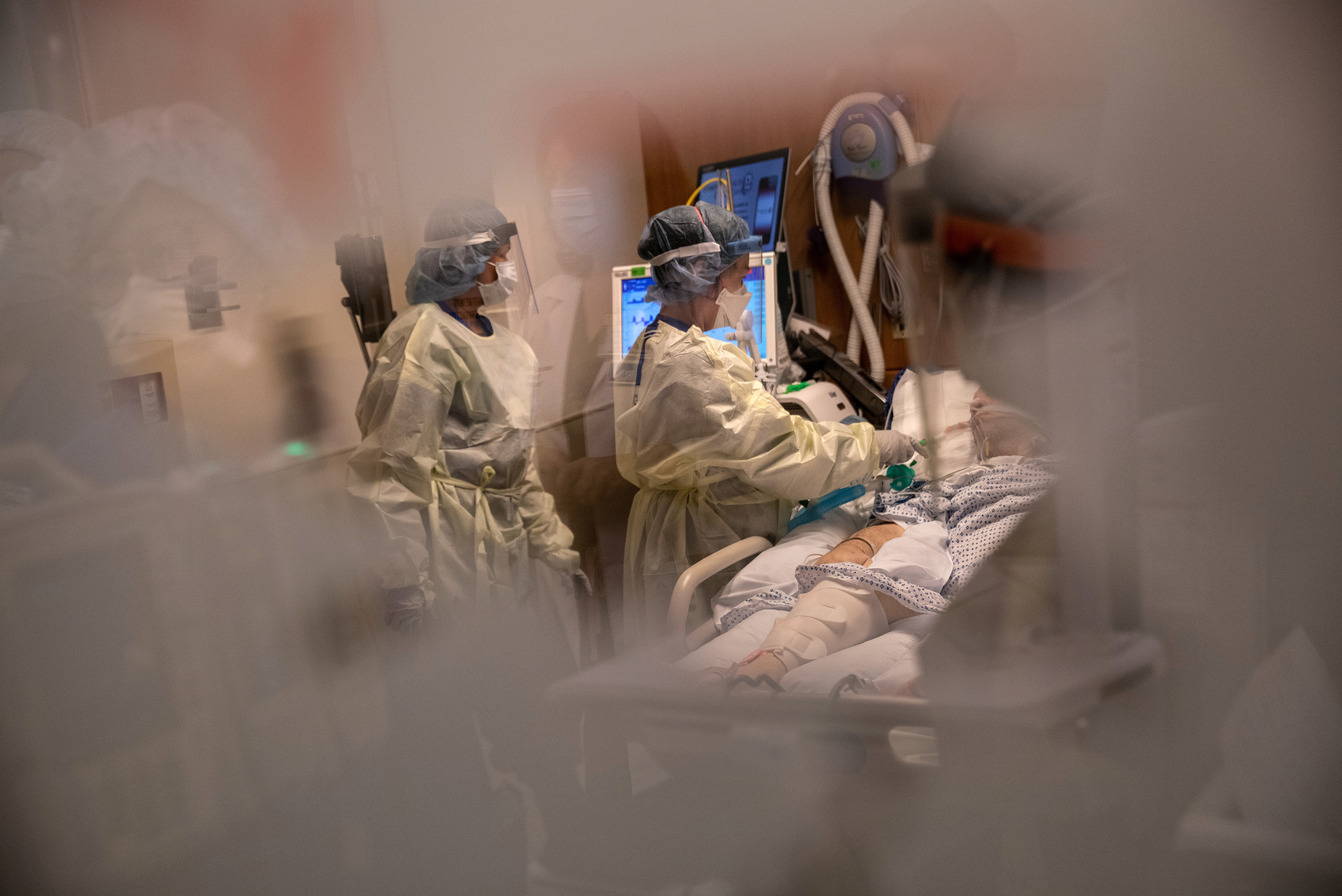 Nurses tend to a COVID-19 patient in an intensive care unit in 2020. Burnout was already an issue among health care workers prior to the pandemic, but short staffing and unpredictable workloads have exacerbated the problem.