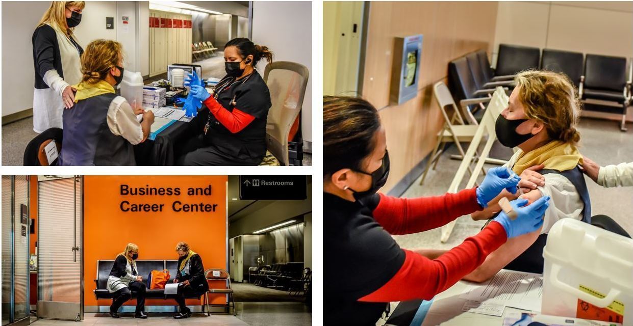 Margaret Applegate (in yellow scarf), a United Airlines customer service agent, is accompanied by Lori Augustine, vice president of United's San Francisco hub, as Applegate gets a COVID-19 vaccine in September ahead of United's mandated deadline. (United Airlines)