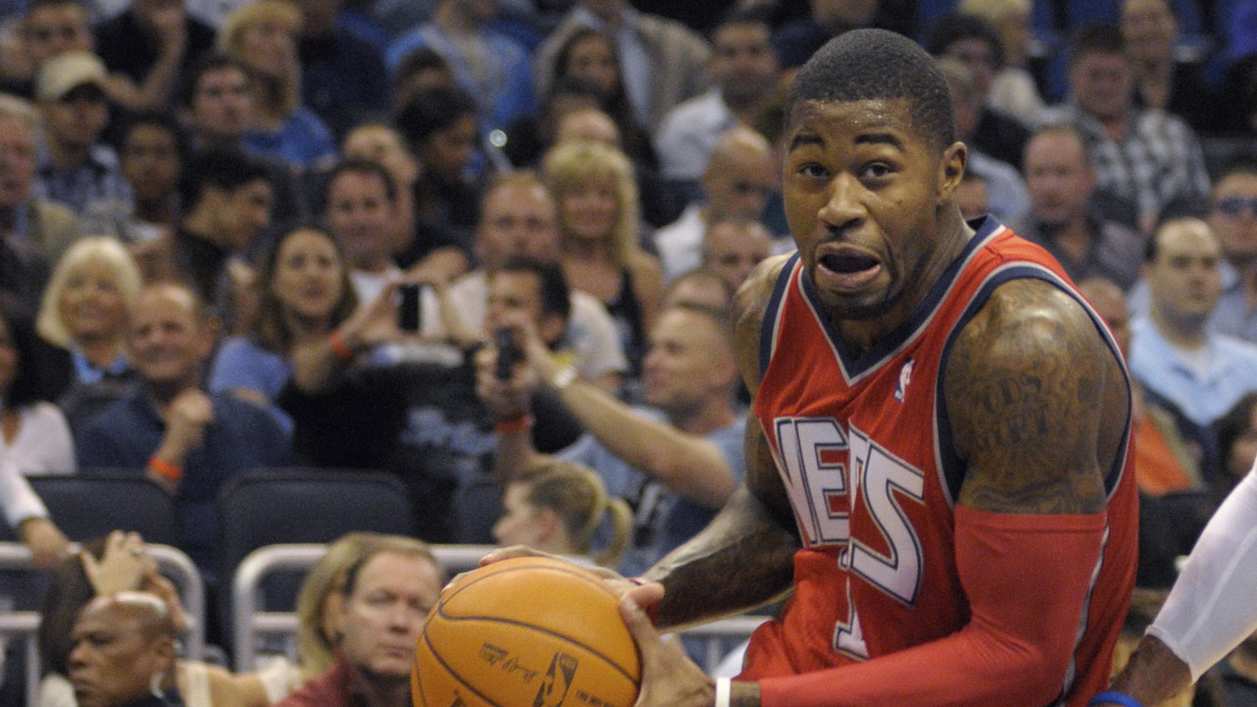 New Jersey Nets guard Terrence Williams (left), seen during a 2010 game in Orlando, Fla., is among 18 former NBA players charged with defrauding the league