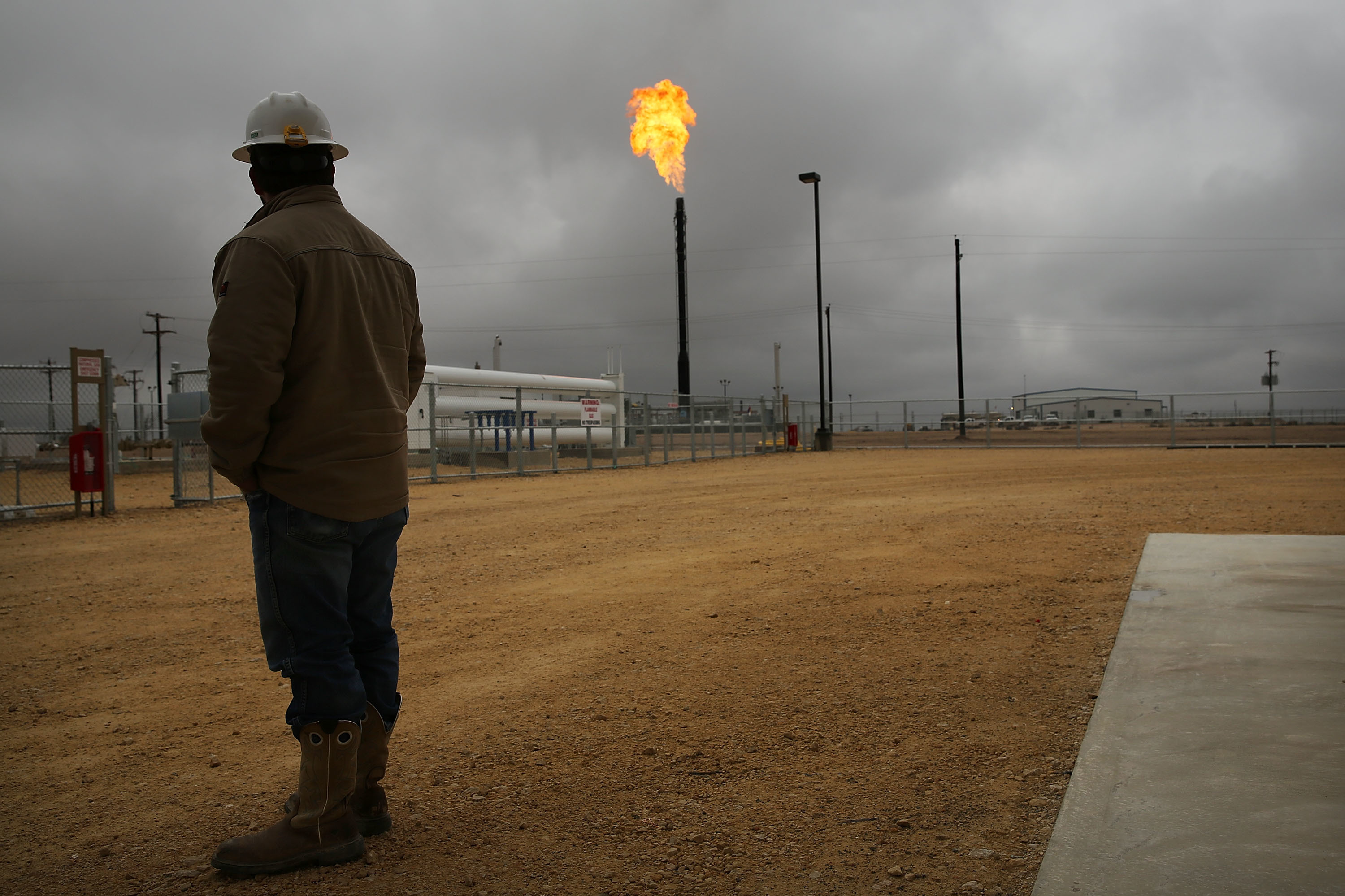 Flared natural gas is burned off at Apache Corporation's operations at the Deadwood natural gas plant in Garden City, Texas, on Feb. 5, 2015.