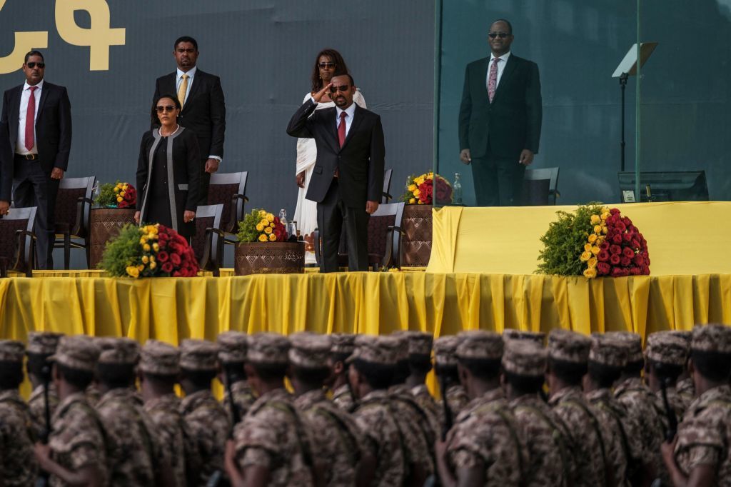 Ethiopian Prime Minister Abiy Ahmed salutes members of the national defense forces during the inauguration ceremony of the new government in early October. (AFP via Getty Images)