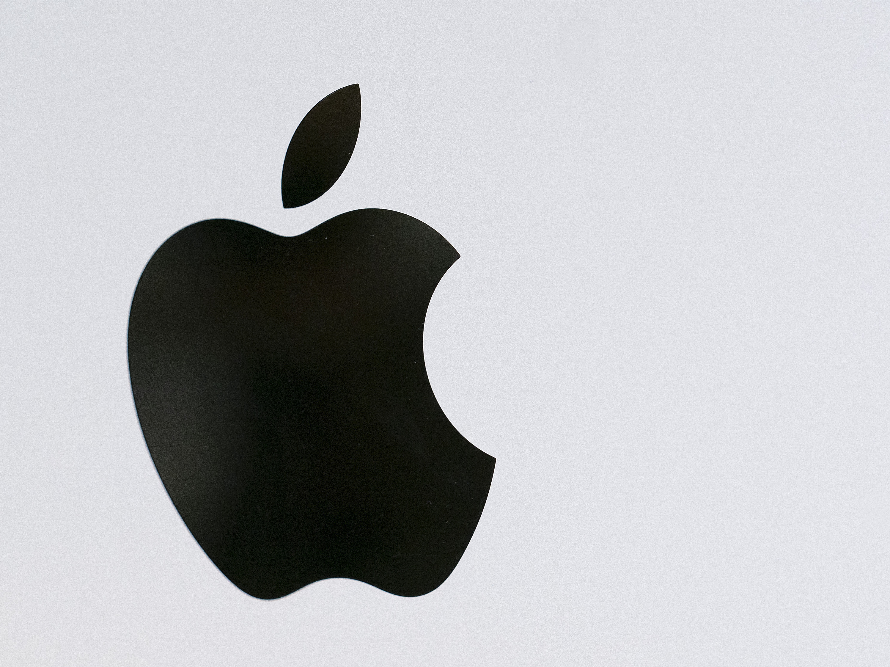 The Apple logo is displayed on a Mac Pro desktop computer on May 21 in New York.