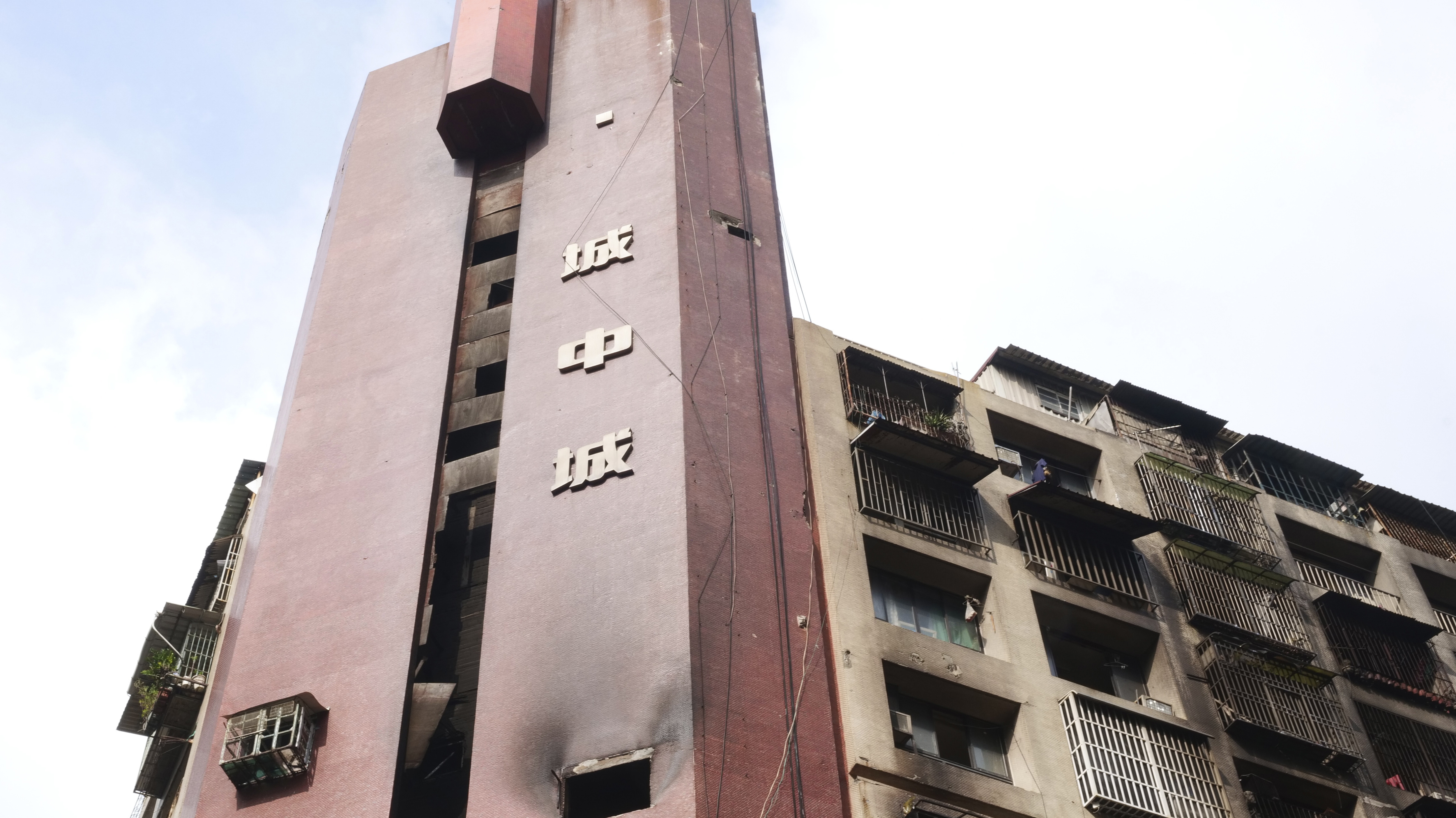 A burnt building is pictured in Kaohsiung in southern Taiwan on Friday. Dozens were killed and dozens more injured after a fire broke out early Thursday in a decades-old mixed commercial and residential building in the Taiwanese port city of Kaohsiung, officials said.