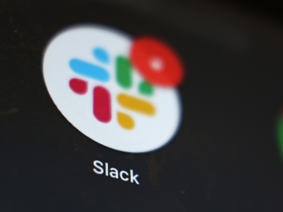 The Slack app icon is displayed on a computer screen on Dec. 2, 2020, in Tokyo. Salesforce completed a deal to buy the popular work messaging platform earlier this year.