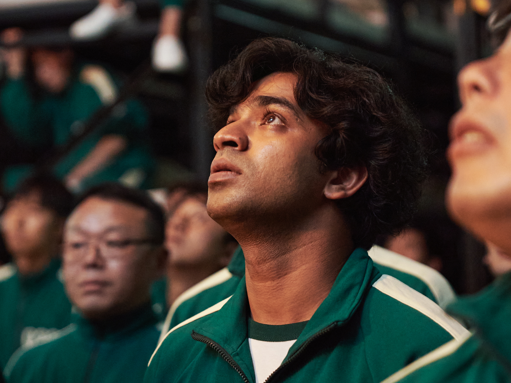 The character Ali Abdul (portrayed by actor Anupam Tripathi) is a Pakistani migrant worker in South Korea whose boss hasn't paid him in months. Ali joins a secret competition called Squid Game to earn money for his family. (Netflix)