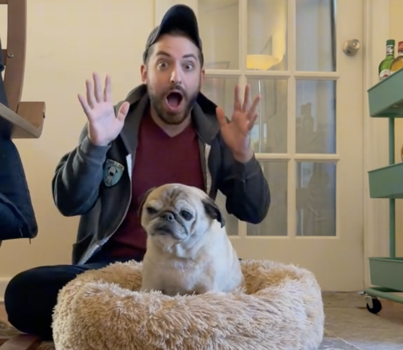 Jonathan Graziano with his pug, Noodle. The two have taken to forecasting the mood of the day based on whether Noodle stands up or flops down in bed. (TikTok)