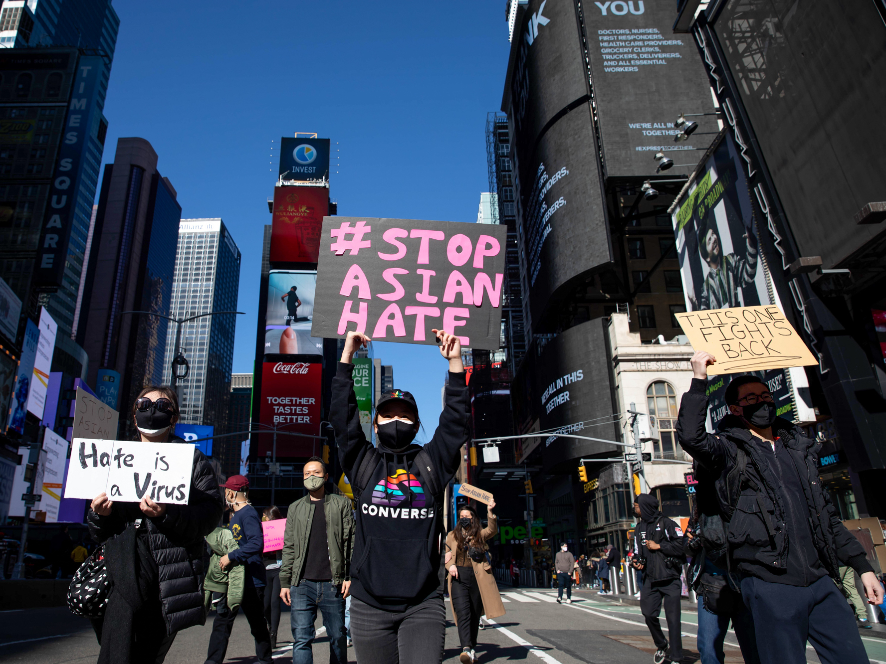 Demonstrators march during a protest against Asian hate in Times Square in New York in March after a troubling spike in violence against the Asian American community during the coronavirus pandemic. (Xinhua News Agency/Getty Images)