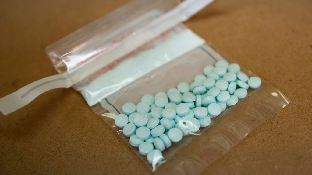 Tablets believed to be laced with fentanyl are displayed at a Drug Enforcement Administration lab in New York in 2019. The Biden administration is hoping to crack down on abuse of synthetic opioids in part by putting them in the most restricted category or &quot;schedule&quot; under the law. (AFP via Getty Images)
