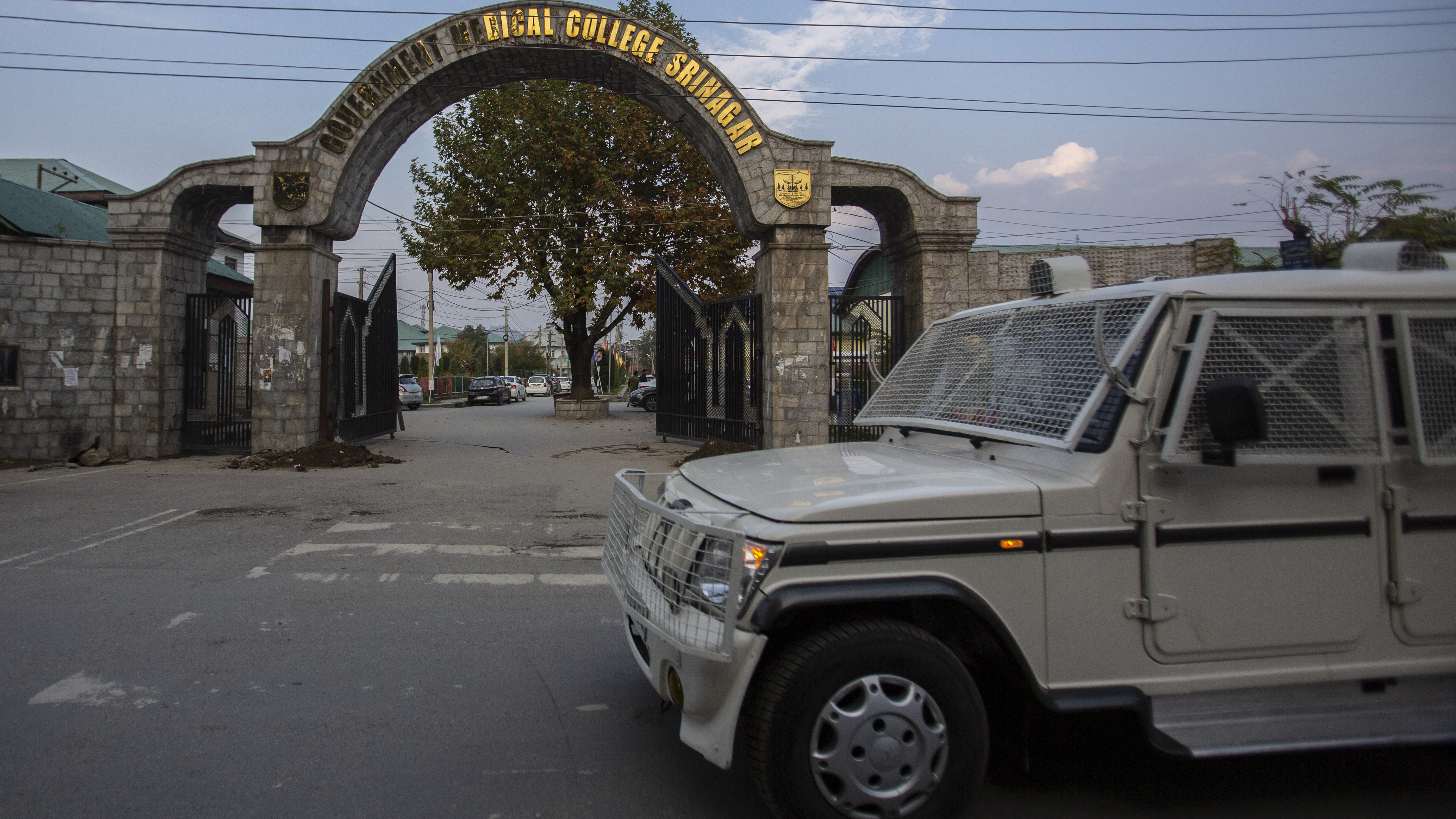 A paramilitary vehicle passes the front gate of Government Medical College in Srinagar, Indian controlled Kashmir on Tuesday. Police have registered two separate cases under harsh anti-terror law against students and some staff of two medical colleges for celebrating Pakistan